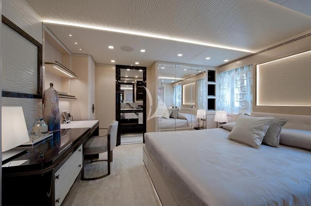 a large bedroom with a large bed aboard SCORPION Yacht for Charter