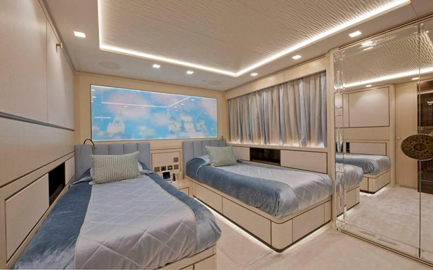 a room with a bed and a television aboard SCORPION Yacht for Charter
