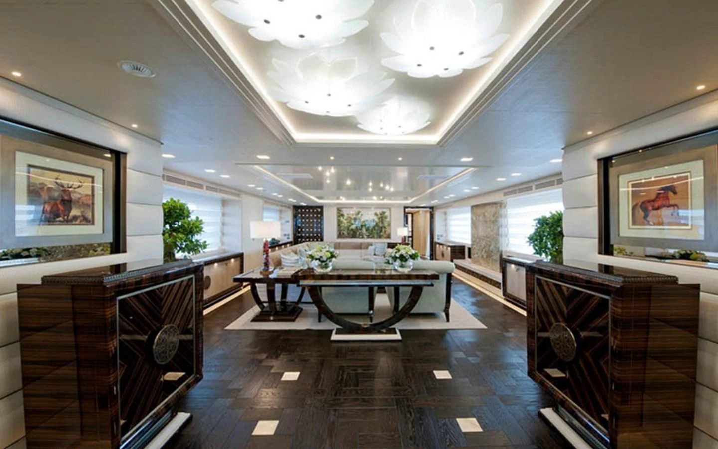 a large room with a table and chairs aboard SCORPION Yacht for Charter