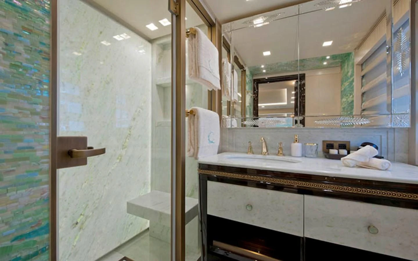 a bathroom with a glass shower aboard SCORPION Yacht for Charter