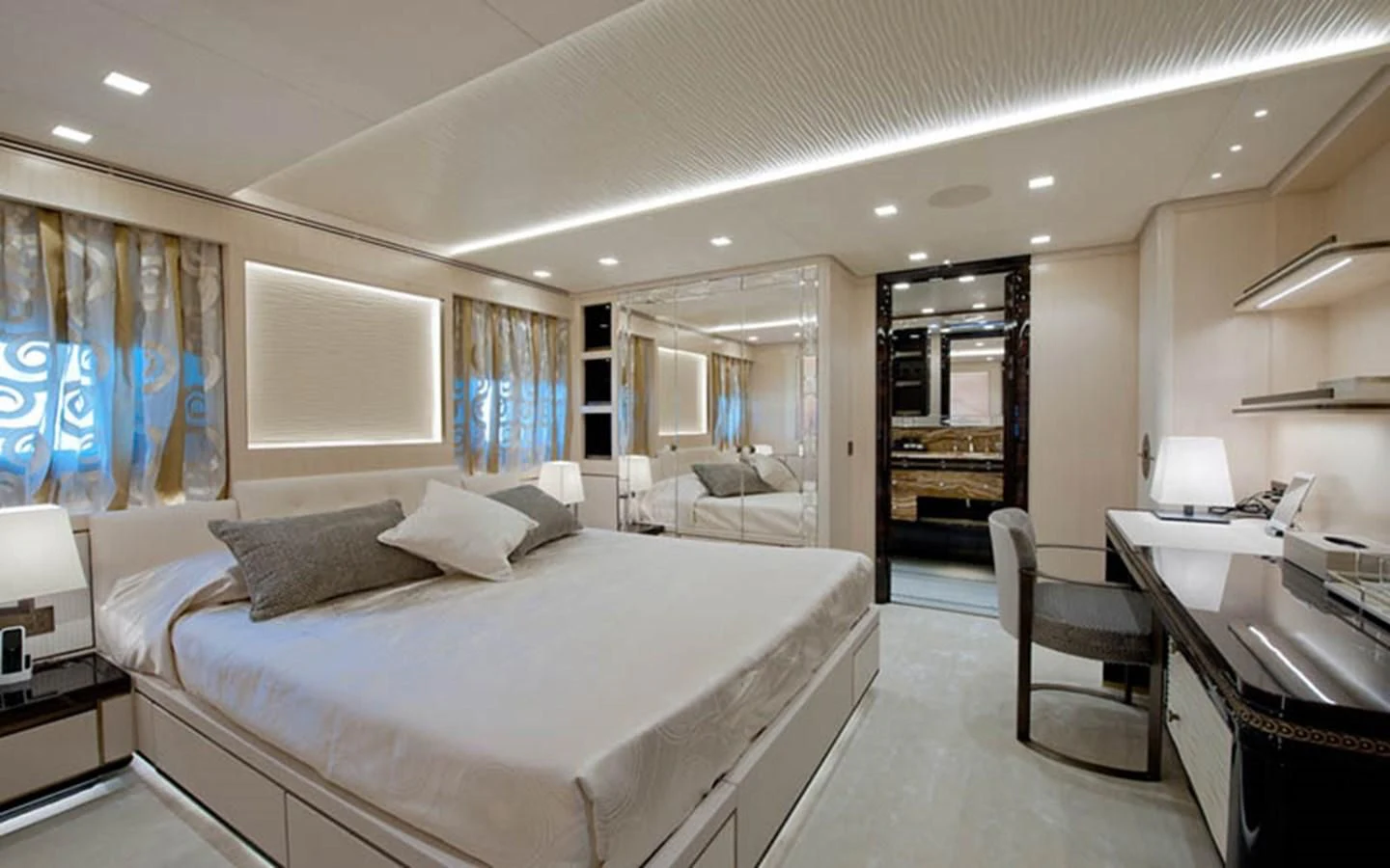 a large bedroom with a large bed aboard SCORPION Yacht for Charter