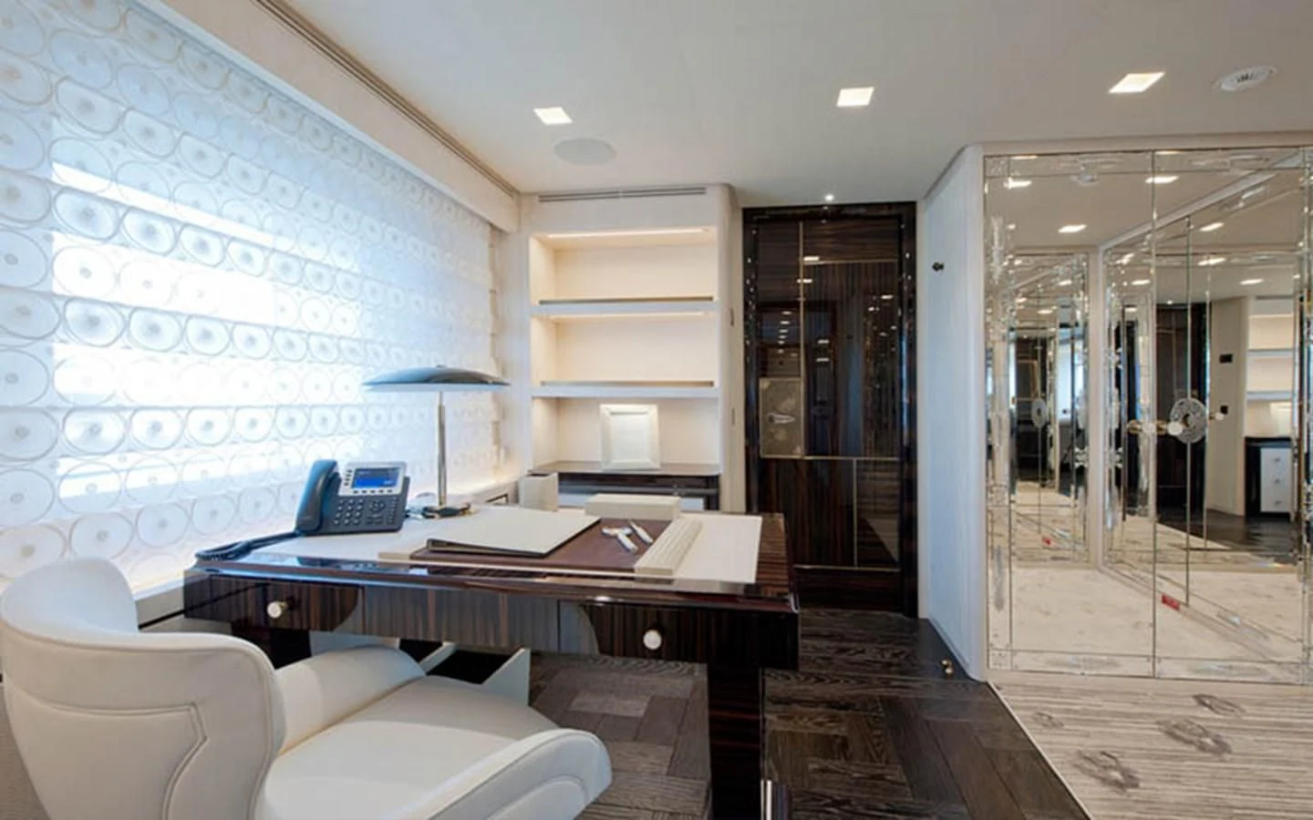 a room with a desk and a chair aboard SCORPION Yacht for Charter