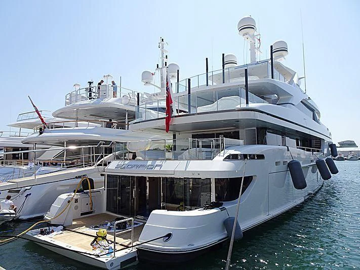 a large white boat docked aboard SCORPION Yacht for Charter