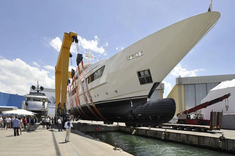 a large military ship docked aboard SCORPION Yacht for Charter