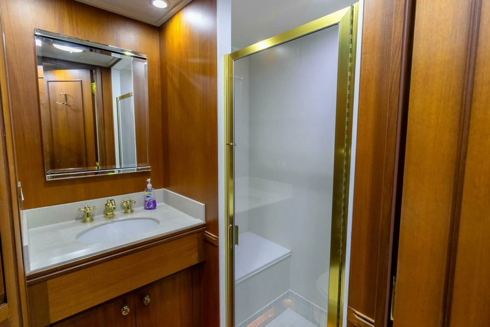 a bathroom with a sink and a mirror aboard CHAIRMAN Yacht for Sale