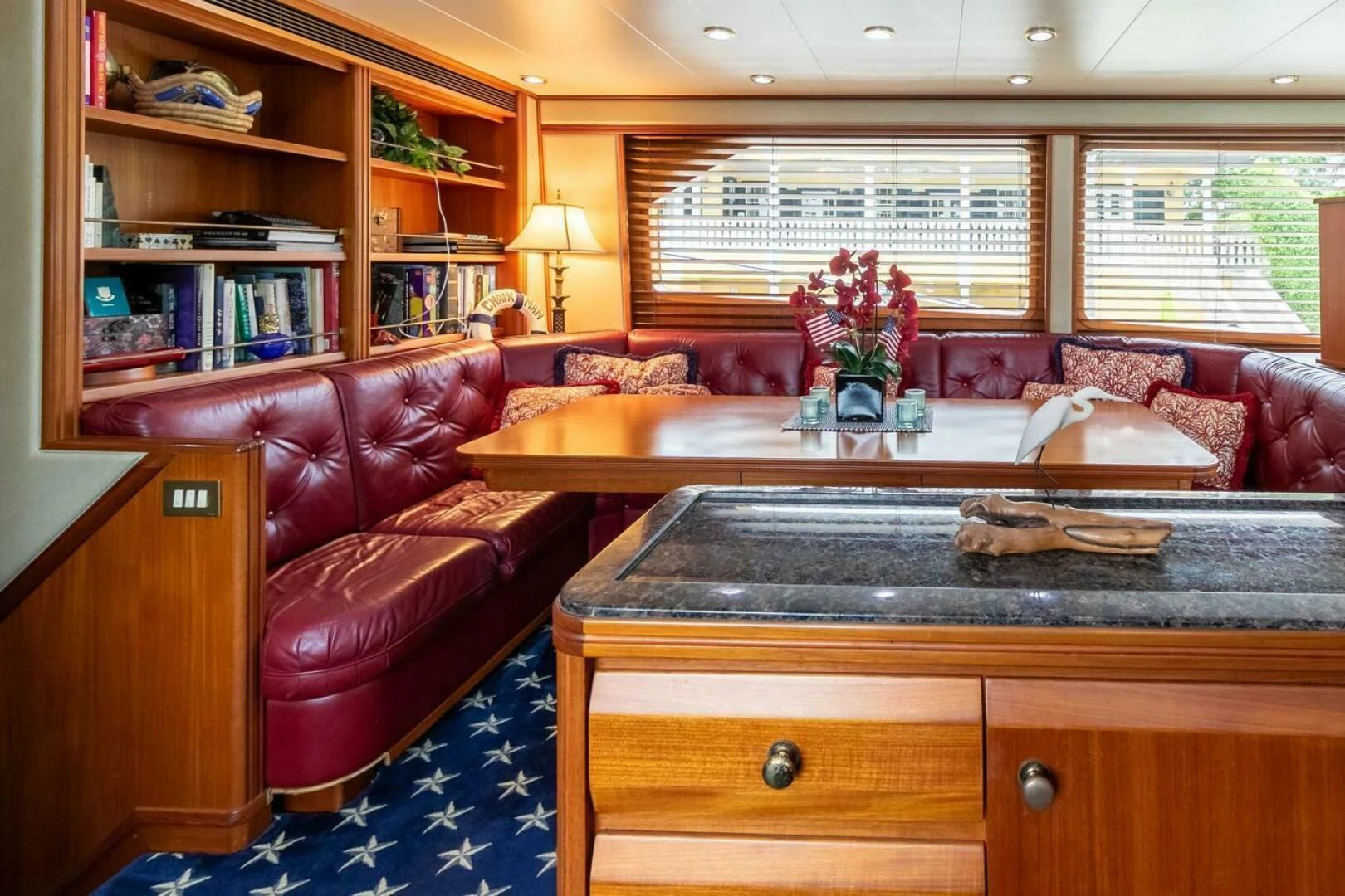 a living room with a couch and a coffee table aboard CHAIRMAN Yacht for Sale