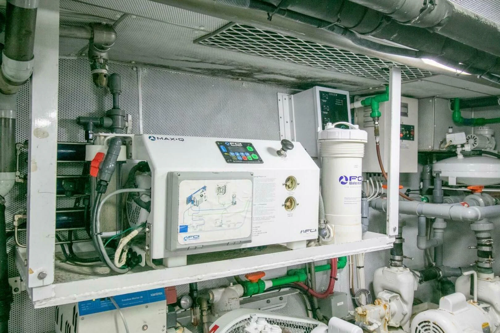 a white machine with a blue label aboard CHAIRMAN Yacht for Sale