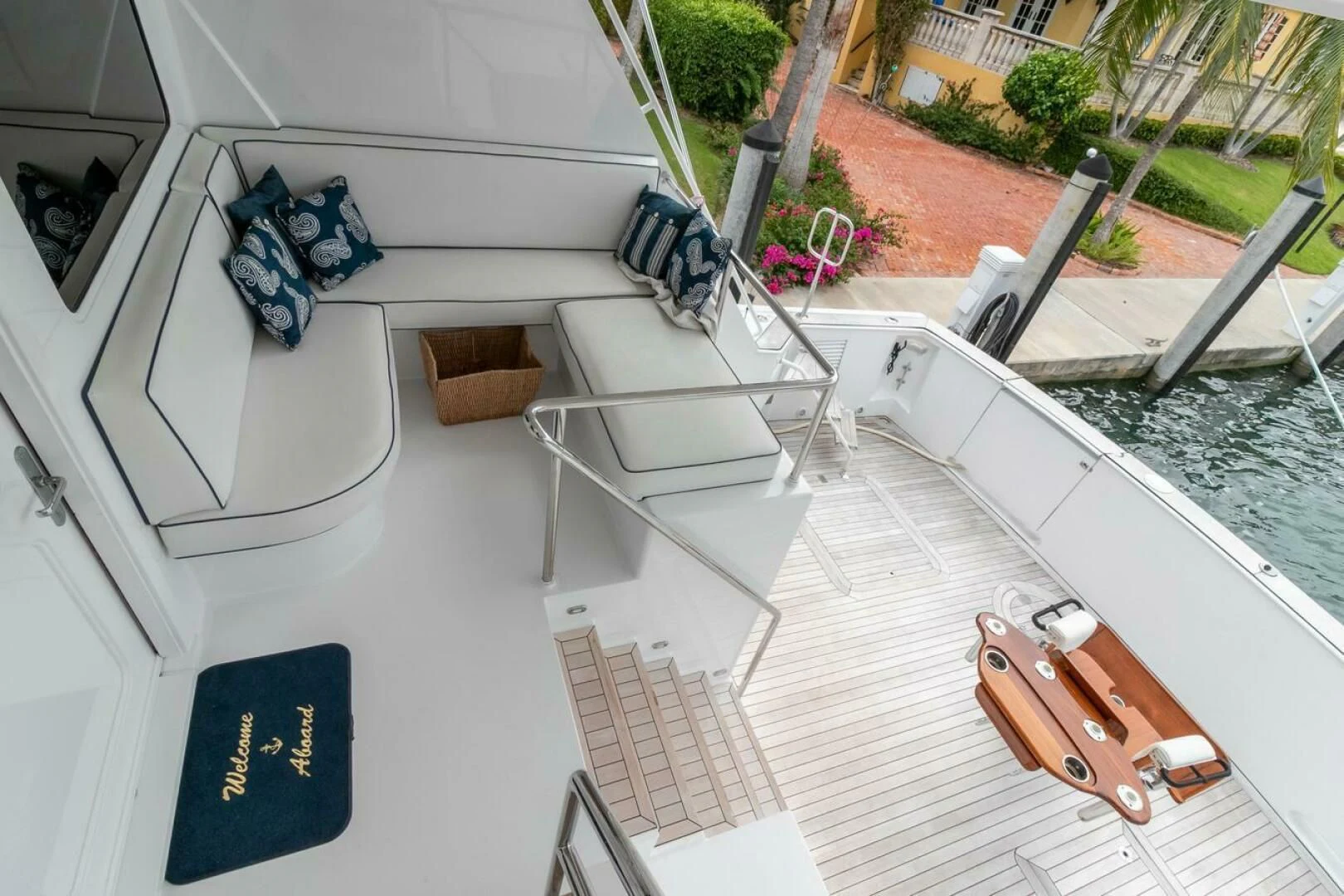 a balcony with a chair and a table and chairs on it aboard CHAIRMAN Yacht for Sale