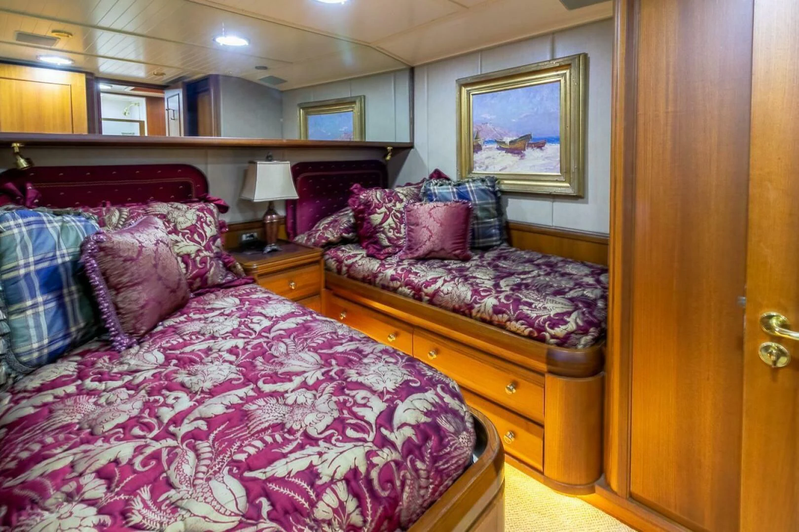a bedroom with a bed and a dresser aboard CHAIRMAN Yacht for Sale