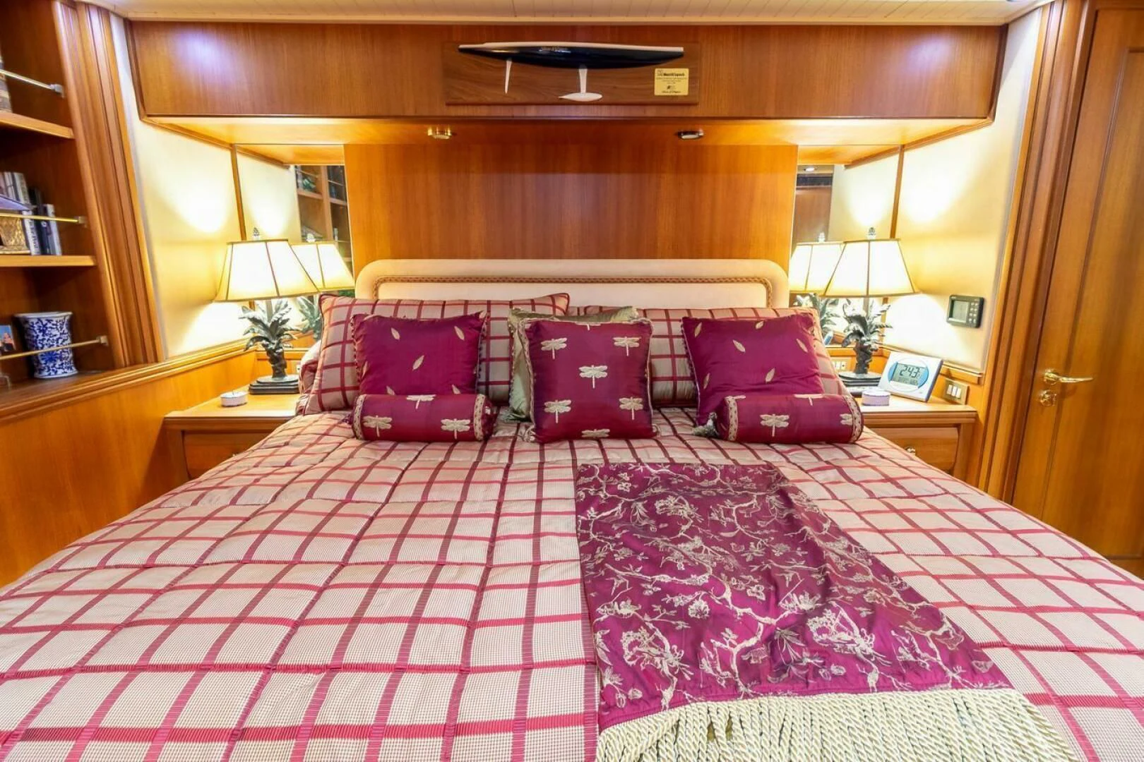 a bed with pink pillows aboard CHAIRMAN Yacht for Sale