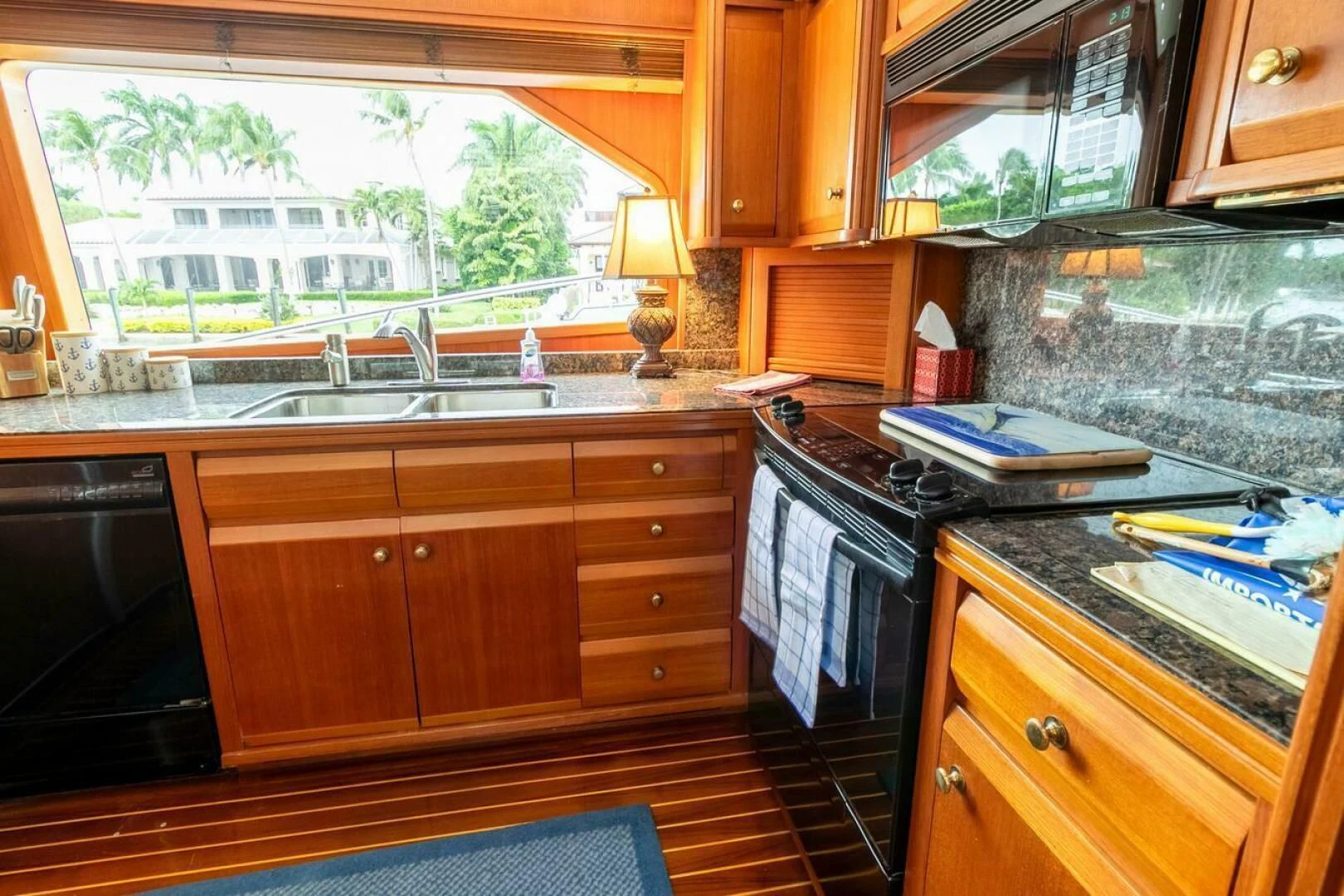 a kitchen with wooden cabinets aboard CHAIRMAN Yacht for Sale