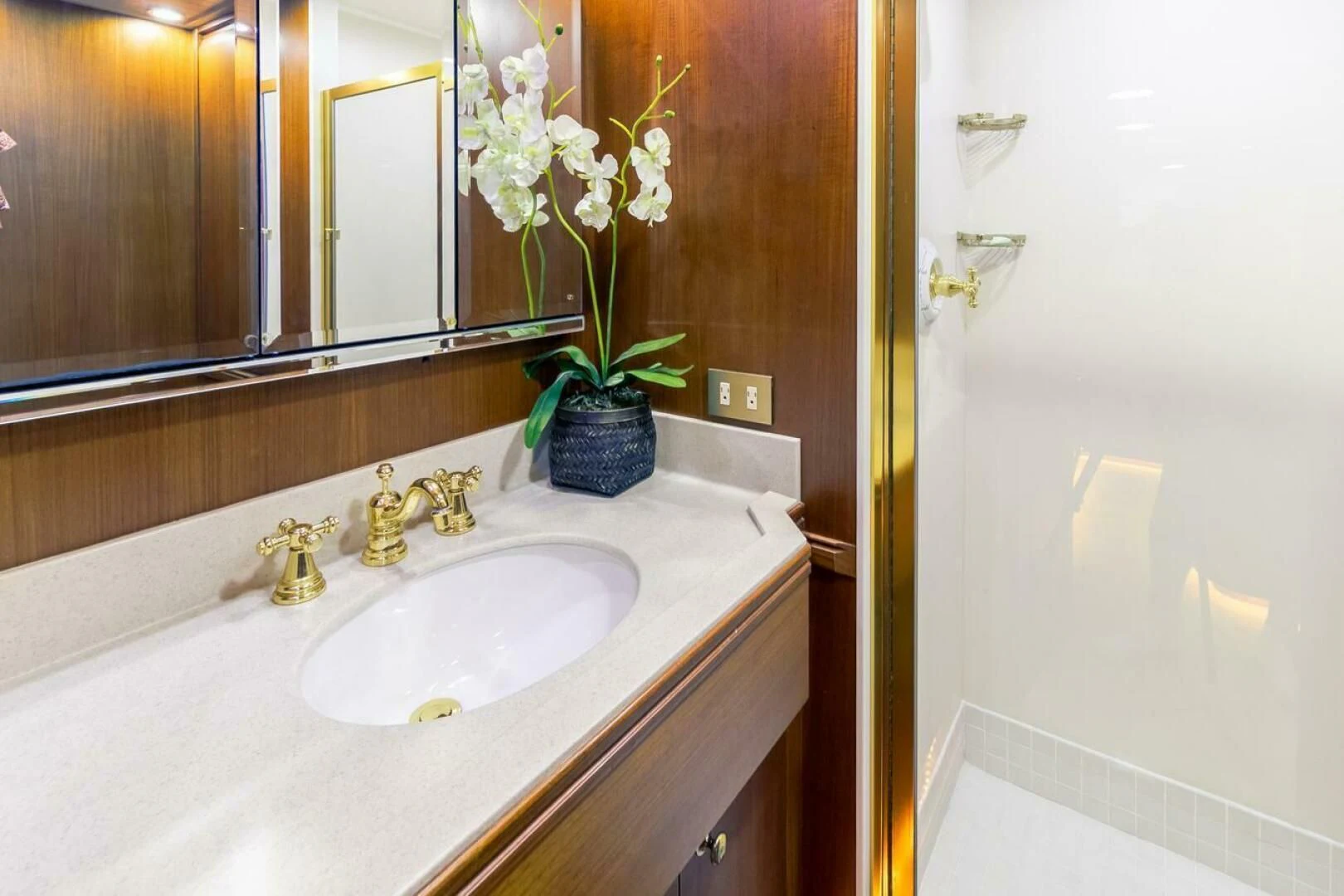 a bathroom sink with a flower pot aboard CHAIRMAN Yacht for Sale