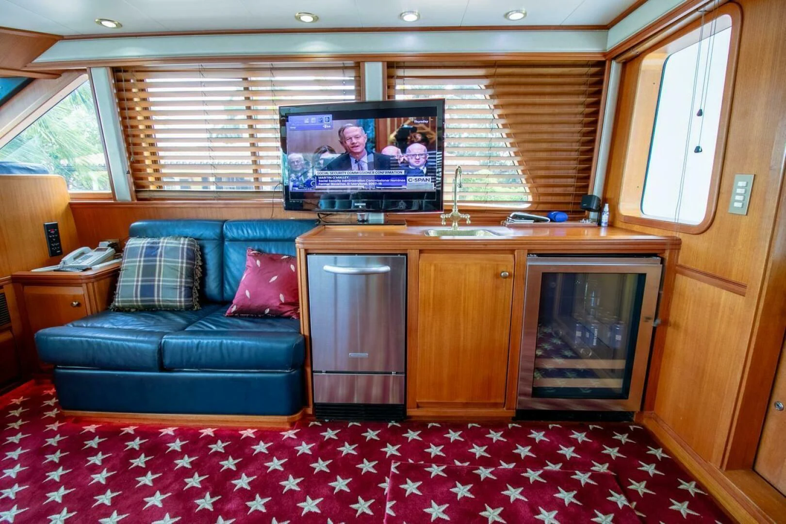 a living room with a couch and tv aboard CHAIRMAN Yacht for Sale