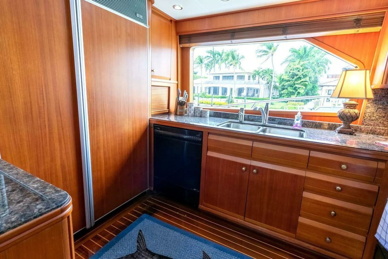 a kitchen with wooden cabinets aboard CHAIRMAN Yacht for Sale