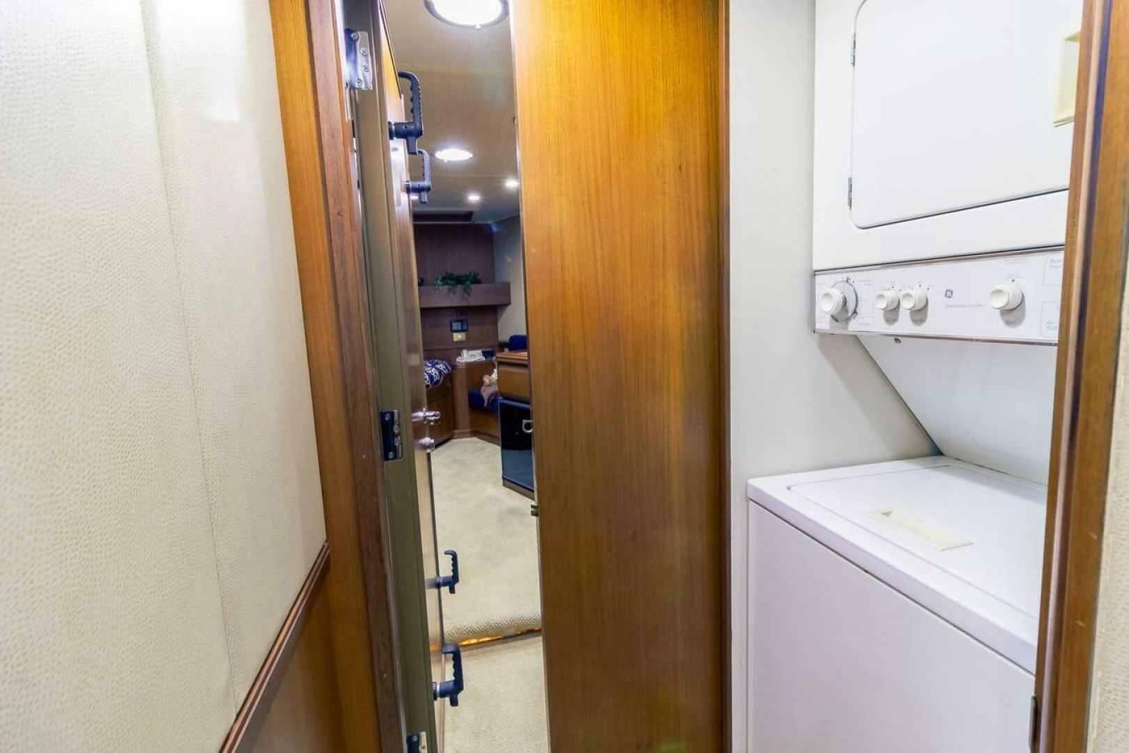 a room with a washing machine and dryer aboard CHAIRMAN Yacht for Sale