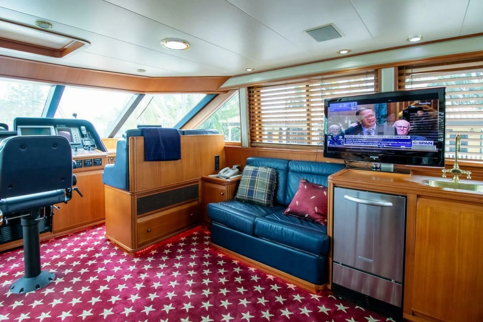 a living room with a couch and tv aboard CHAIRMAN Yacht for Sale