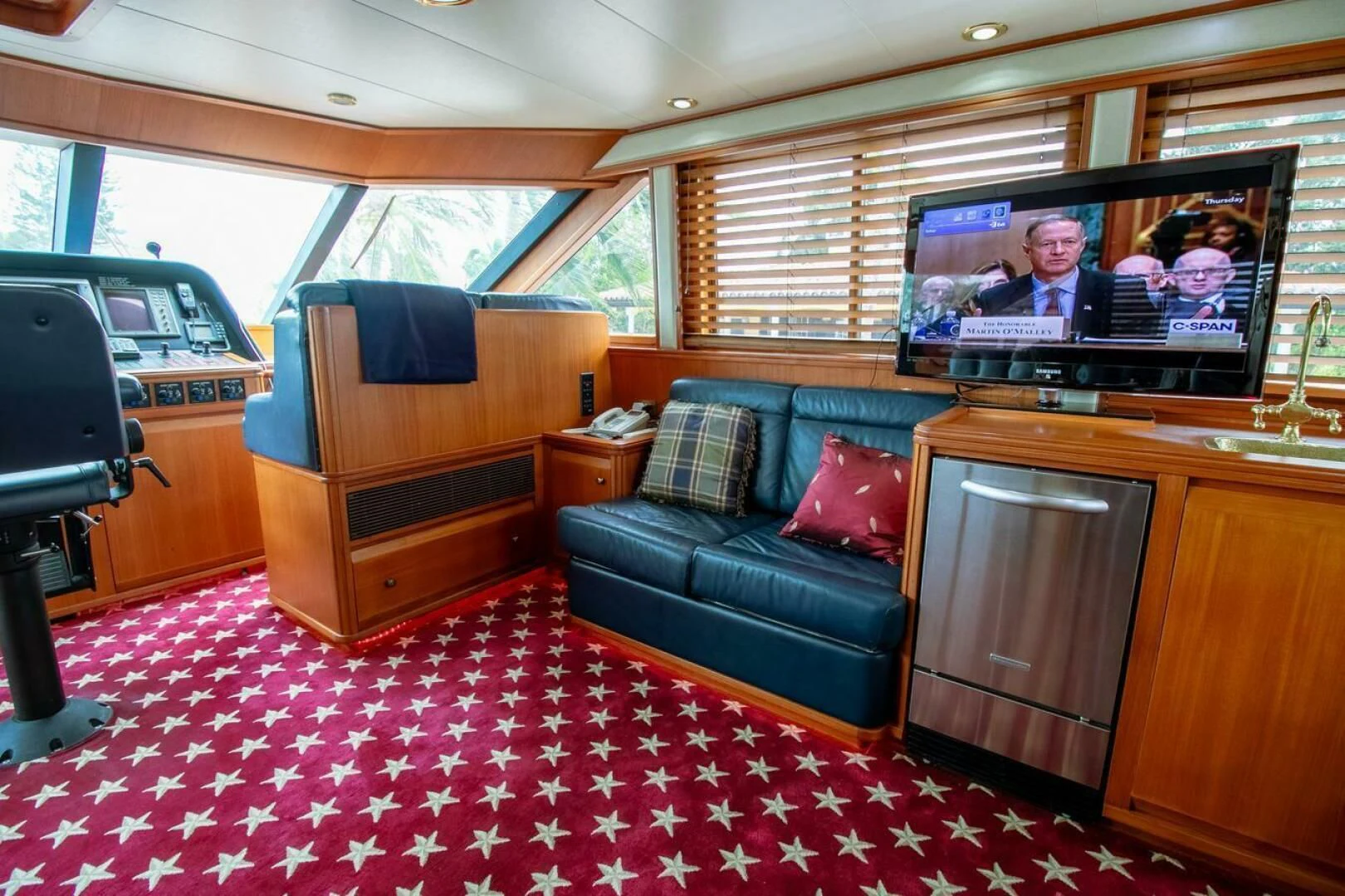 a living room with a couch and a television aboard CHAIRMAN Yacht for Sale