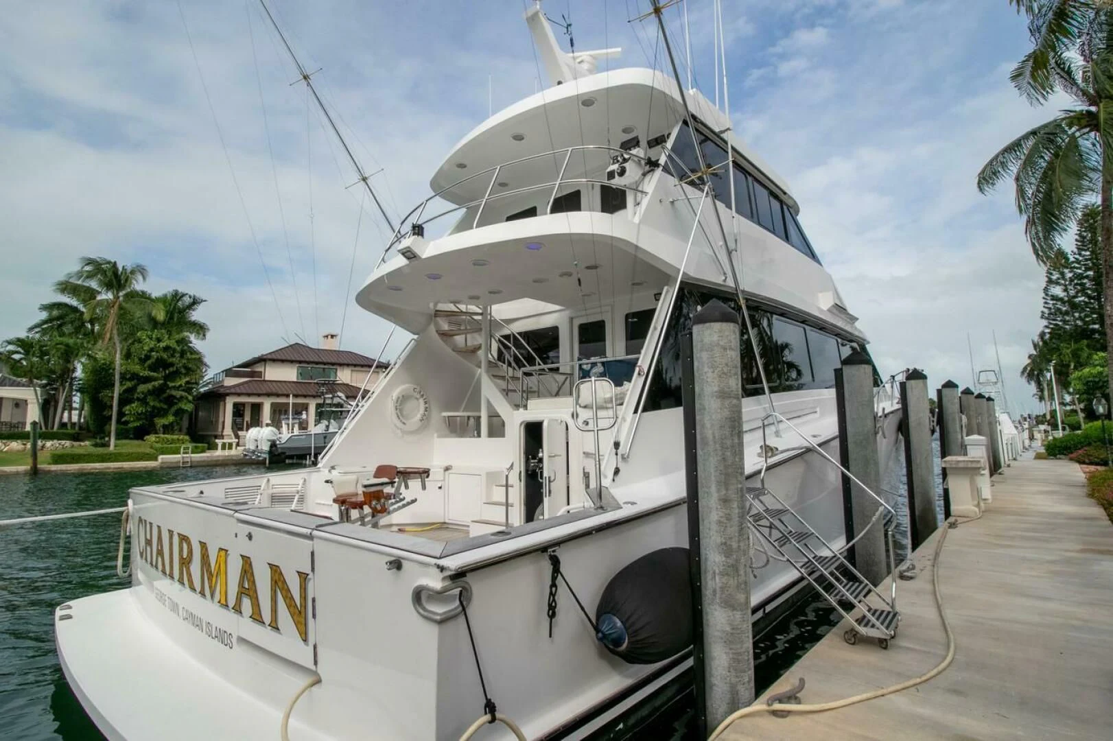 a boat docked at a pier aboard CHAIRMAN Yacht for Sale