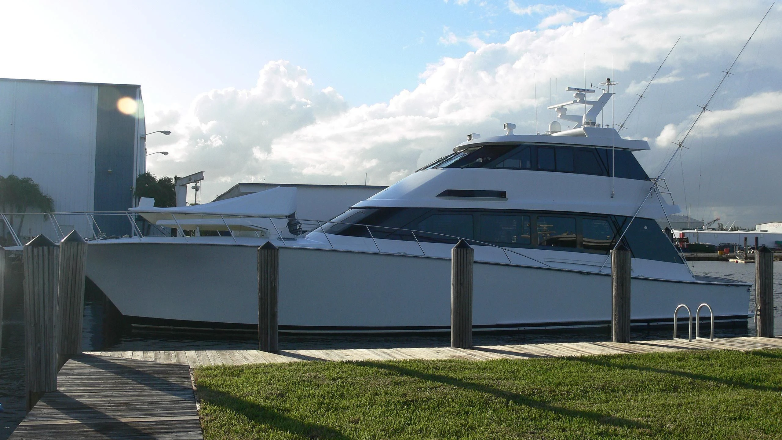 a white yacht parked on a dock aboard CHAIRMAN Yacht for Sale