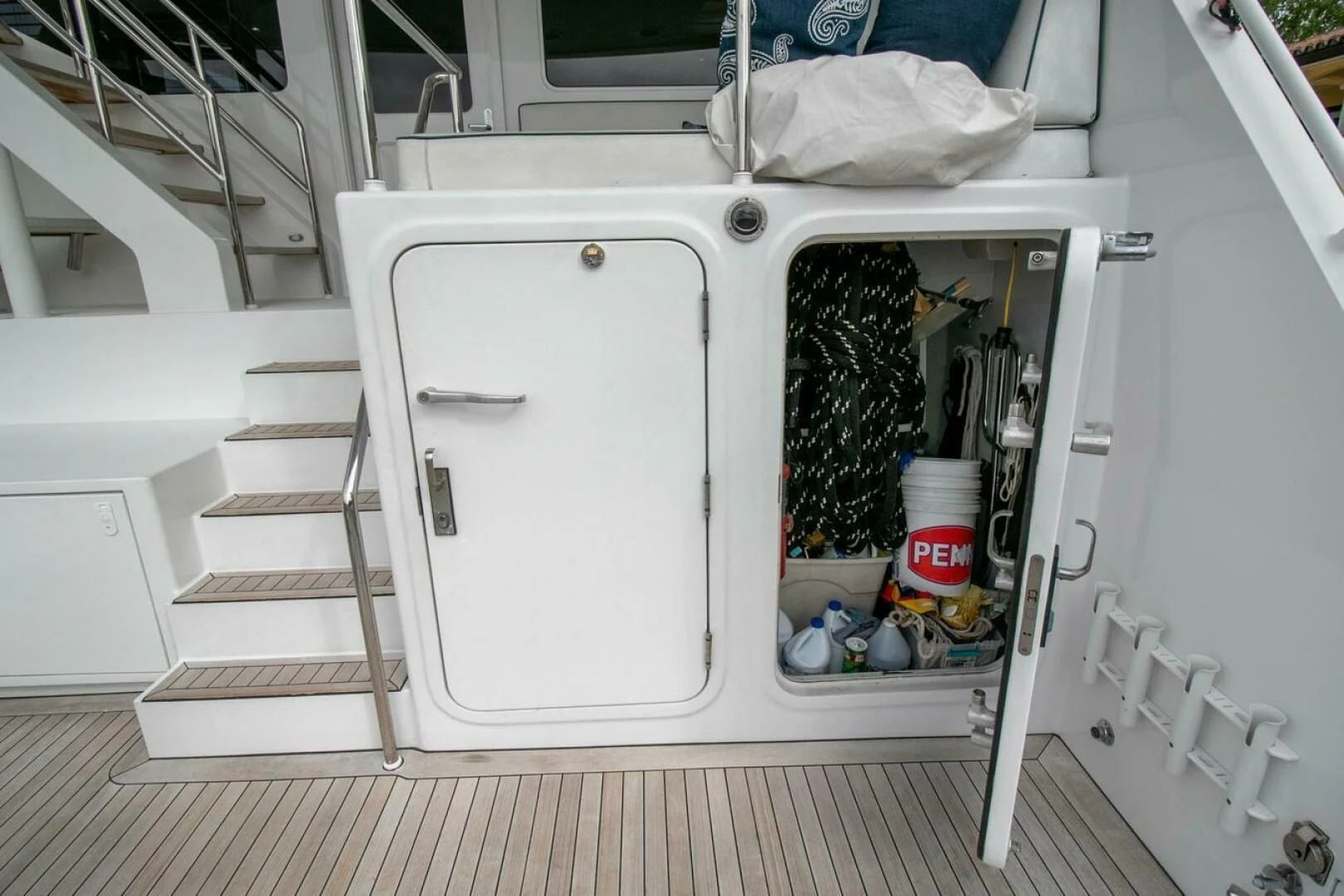 a white cabinet with a door open aboard CHAIRMAN Yacht for Sale