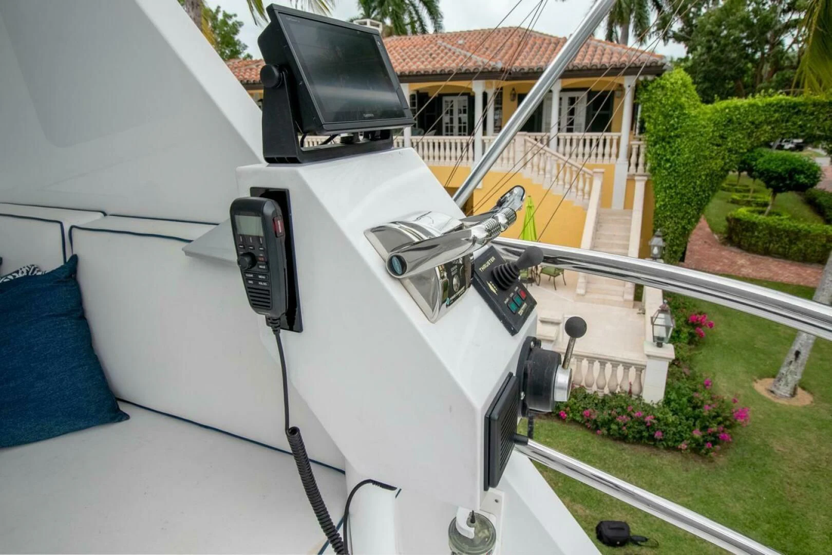 a white car with a black hood parked on grass in front of a house aboard CHAIRMAN Yacht for Sale