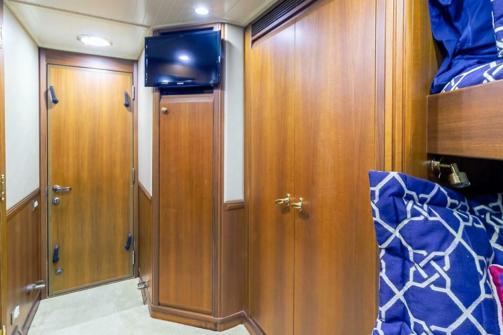 a room with wooden cabinets aboard CHAIRMAN Yacht for Sale