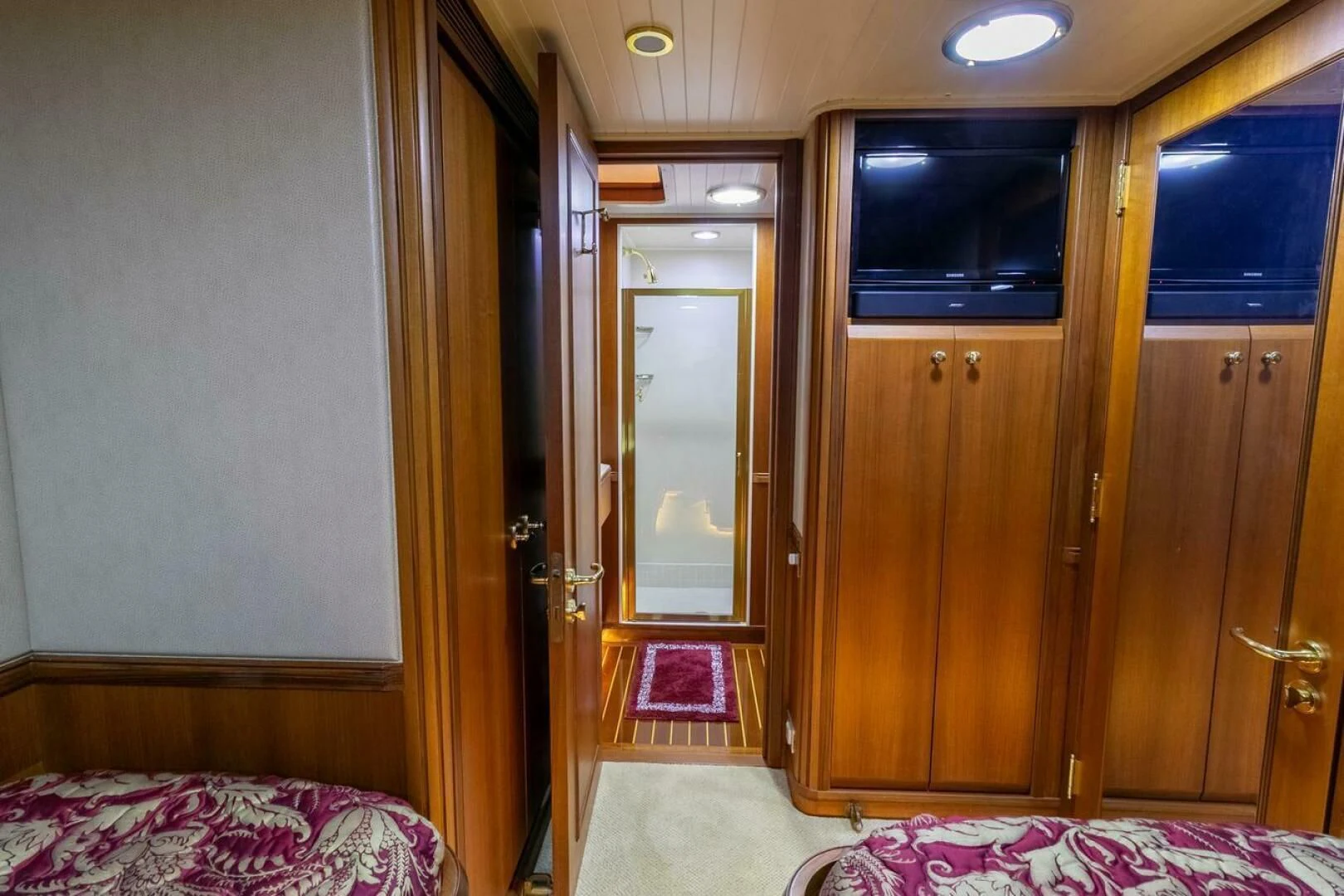 a room with a bed and a door aboard CHAIRMAN Yacht for Sale