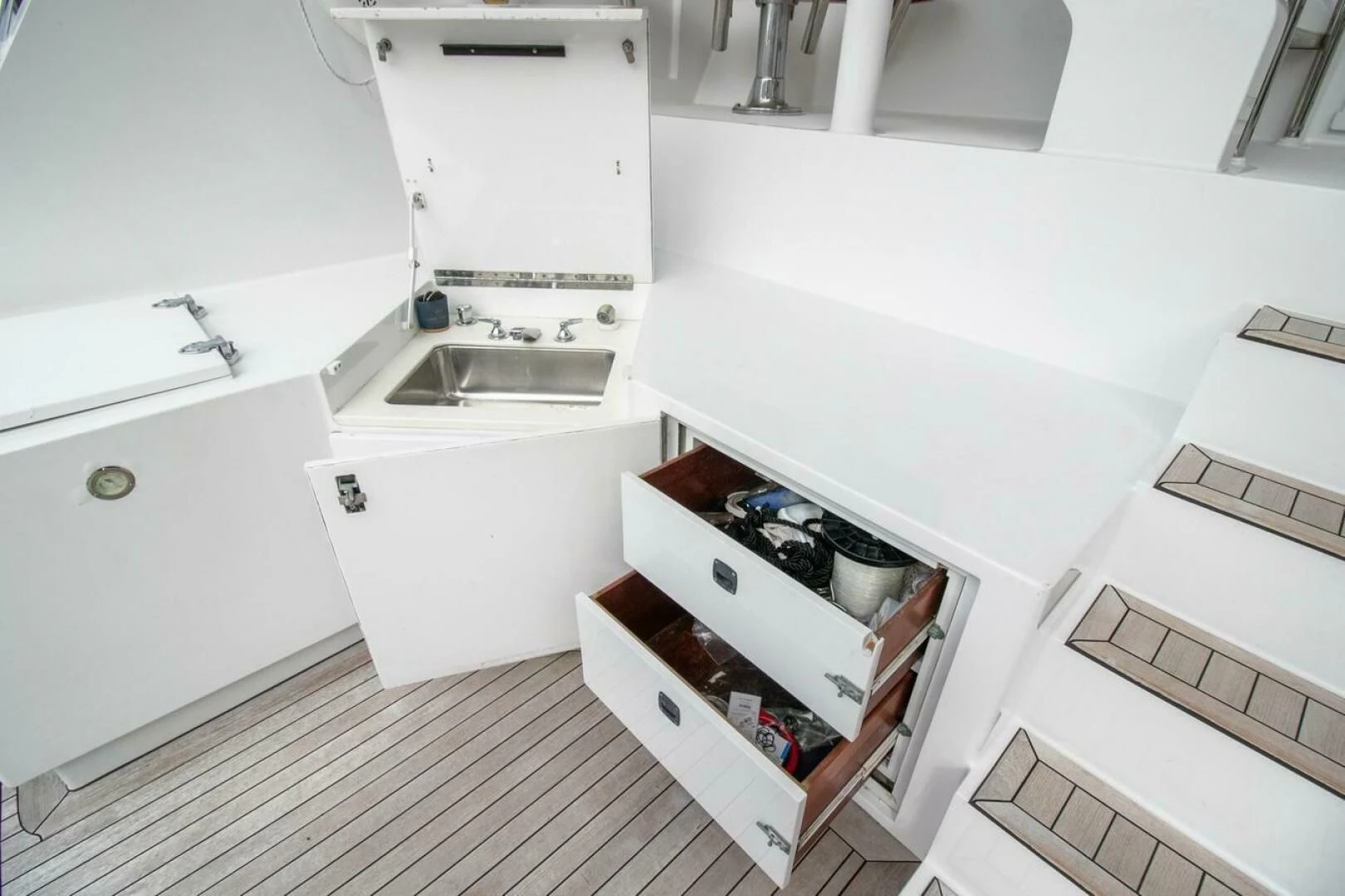 a white kitchen with white cabinets aboard CHAIRMAN Yacht for Sale