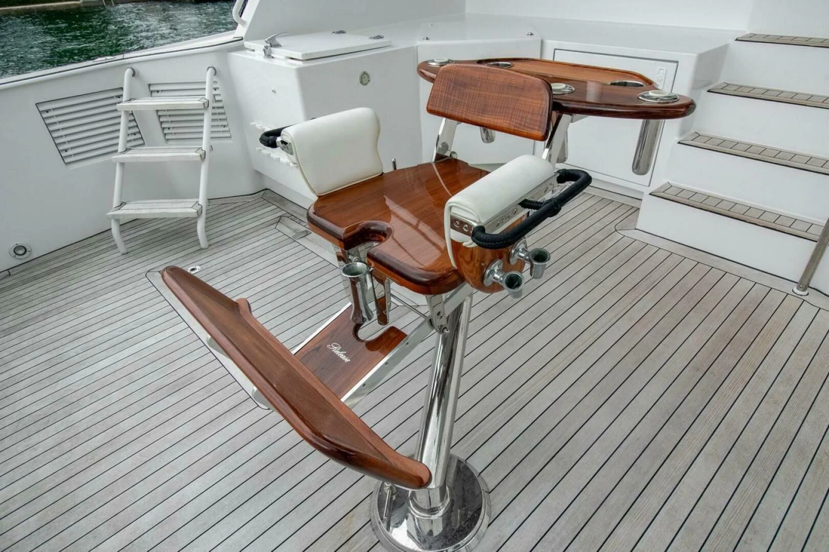 a wooden boat on a deck aboard CHAIRMAN Yacht for Sale