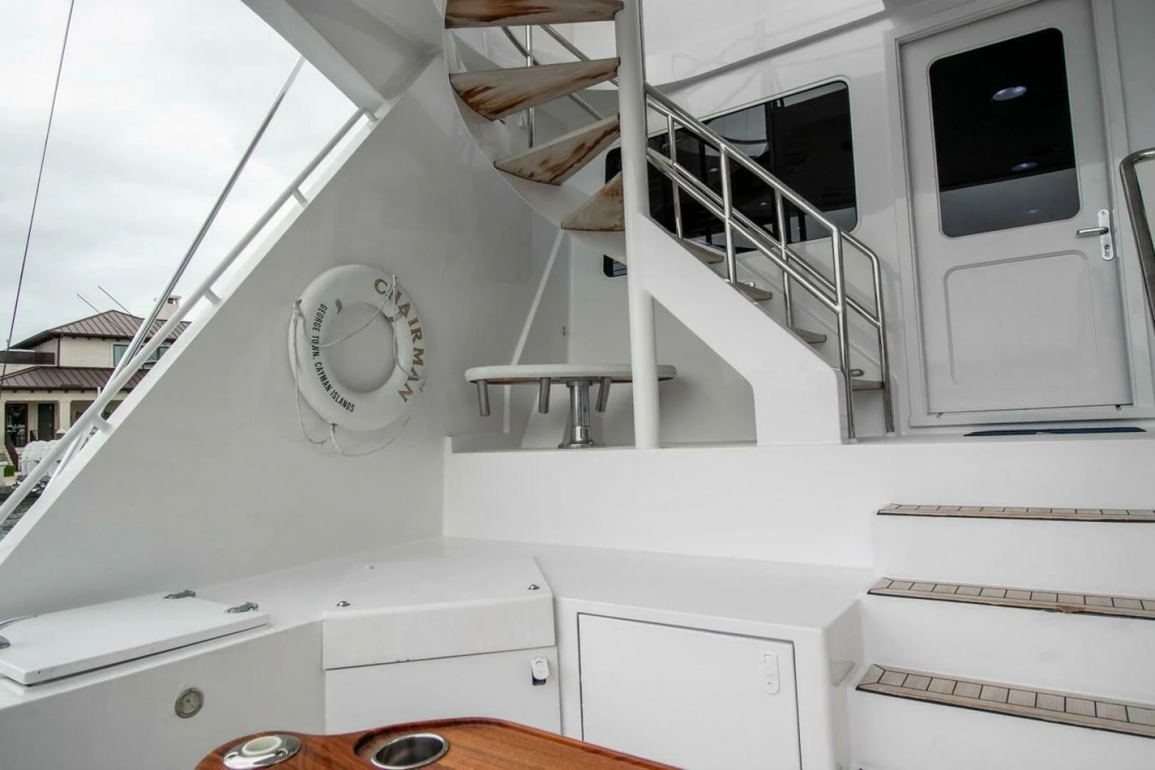 a white house with a staircase aboard CHAIRMAN Yacht for Sale