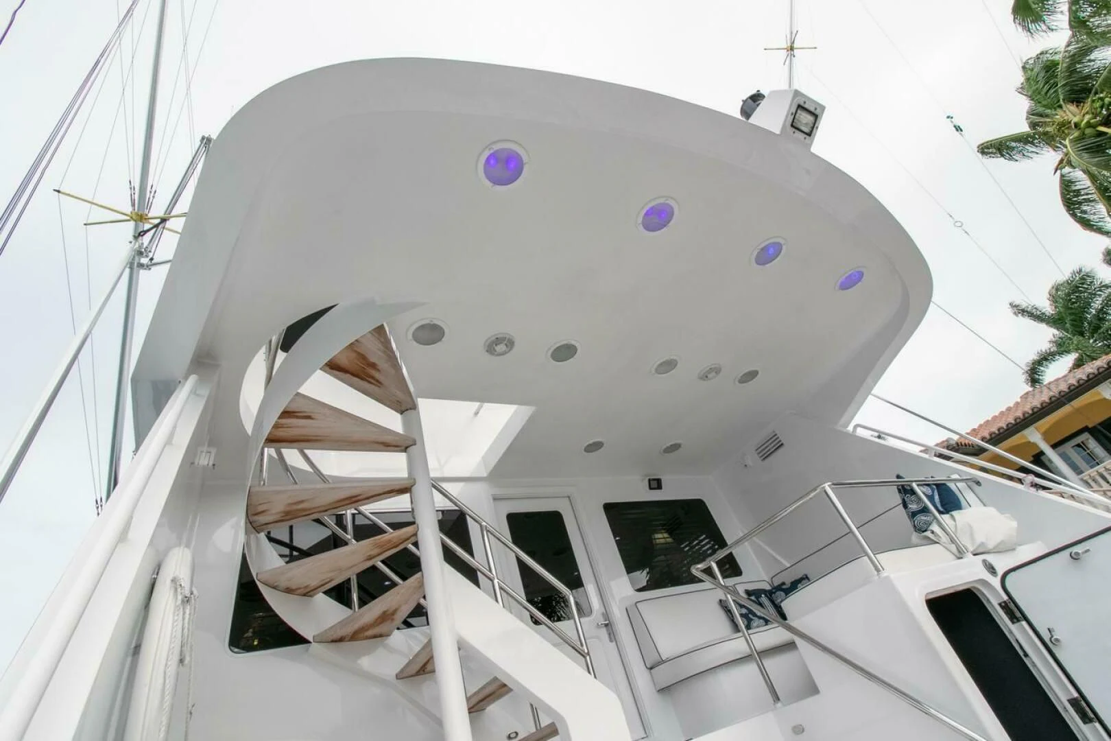 a white building with a spiral staircase aboard CHAIRMAN Yacht for Sale