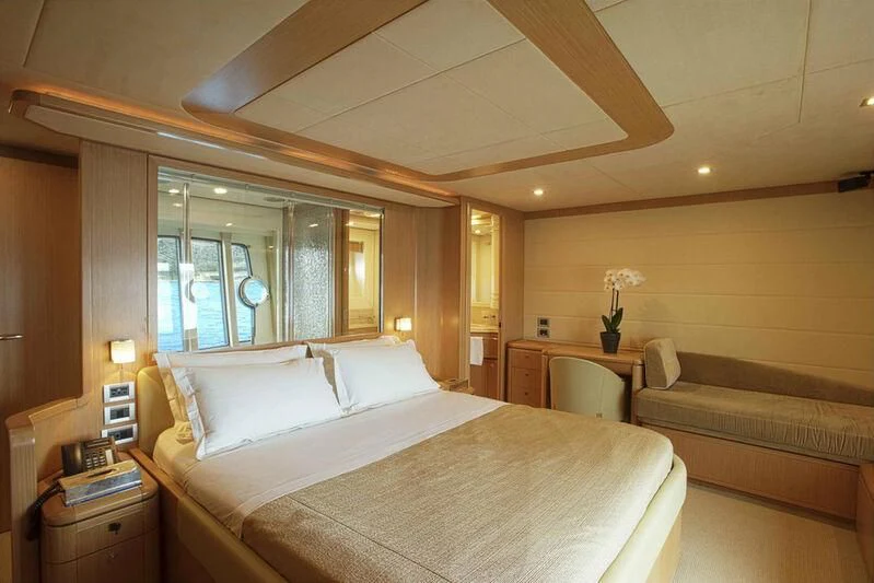 a large bed in a hotel room aboard JULIE M Yacht for Sale