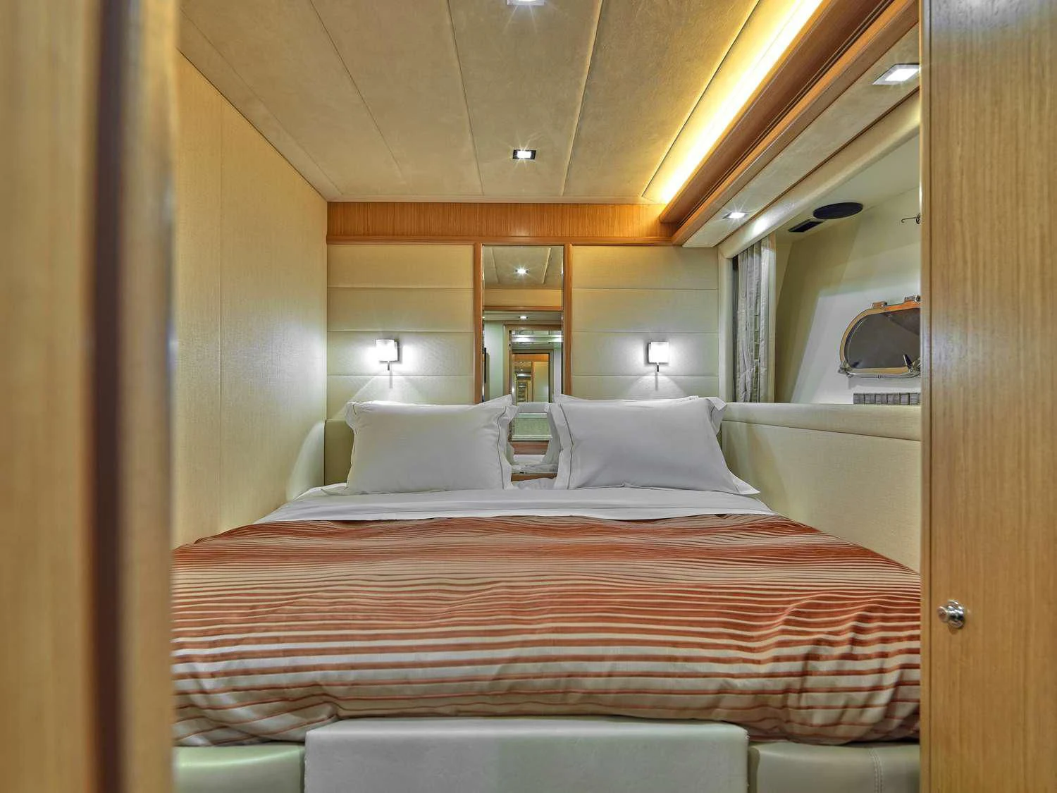 a bed with a pink sheet aboard JULIE M Yacht for Sale