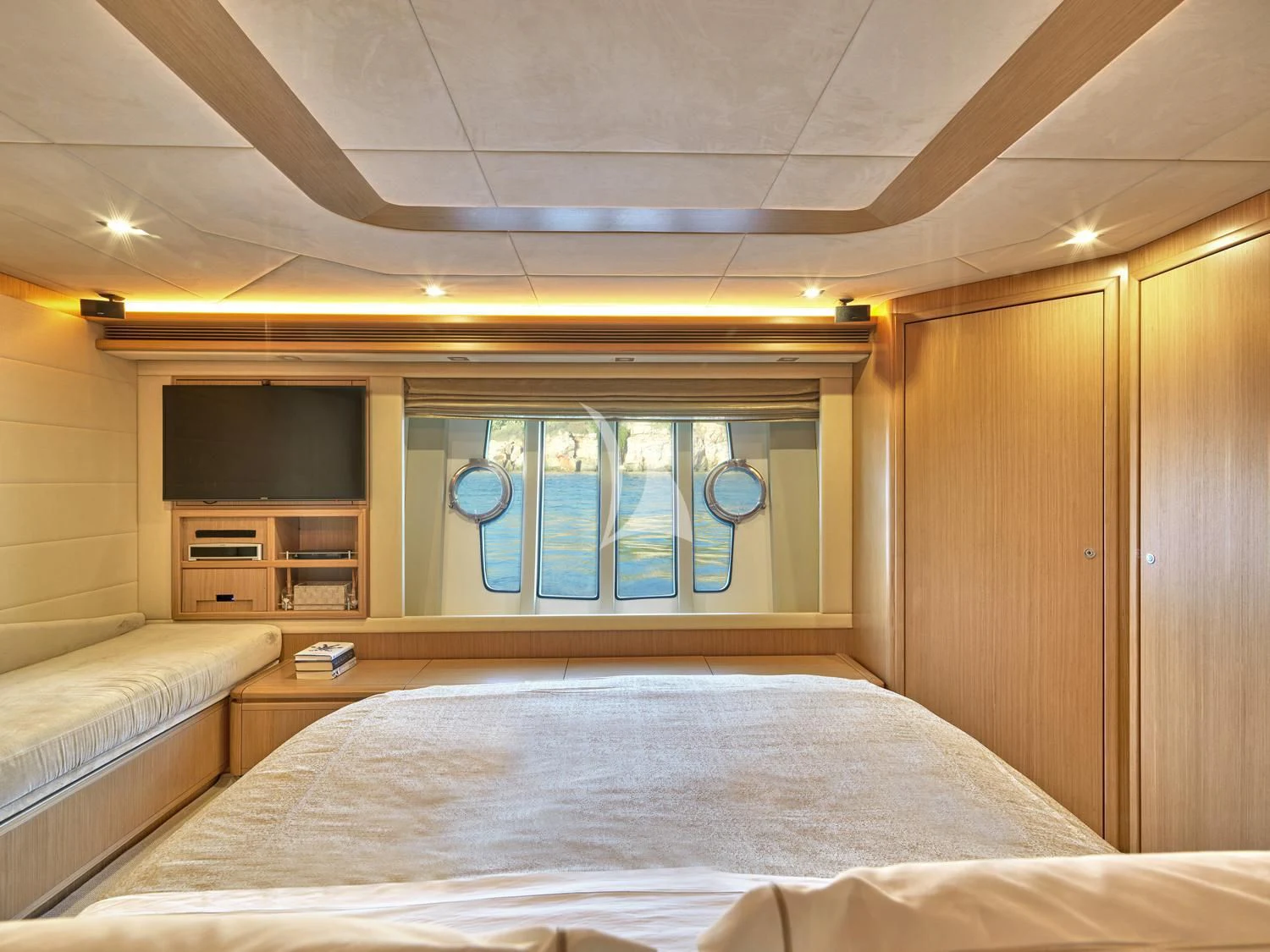 a room with a bed and a television aboard JULIE M Yacht for Sale