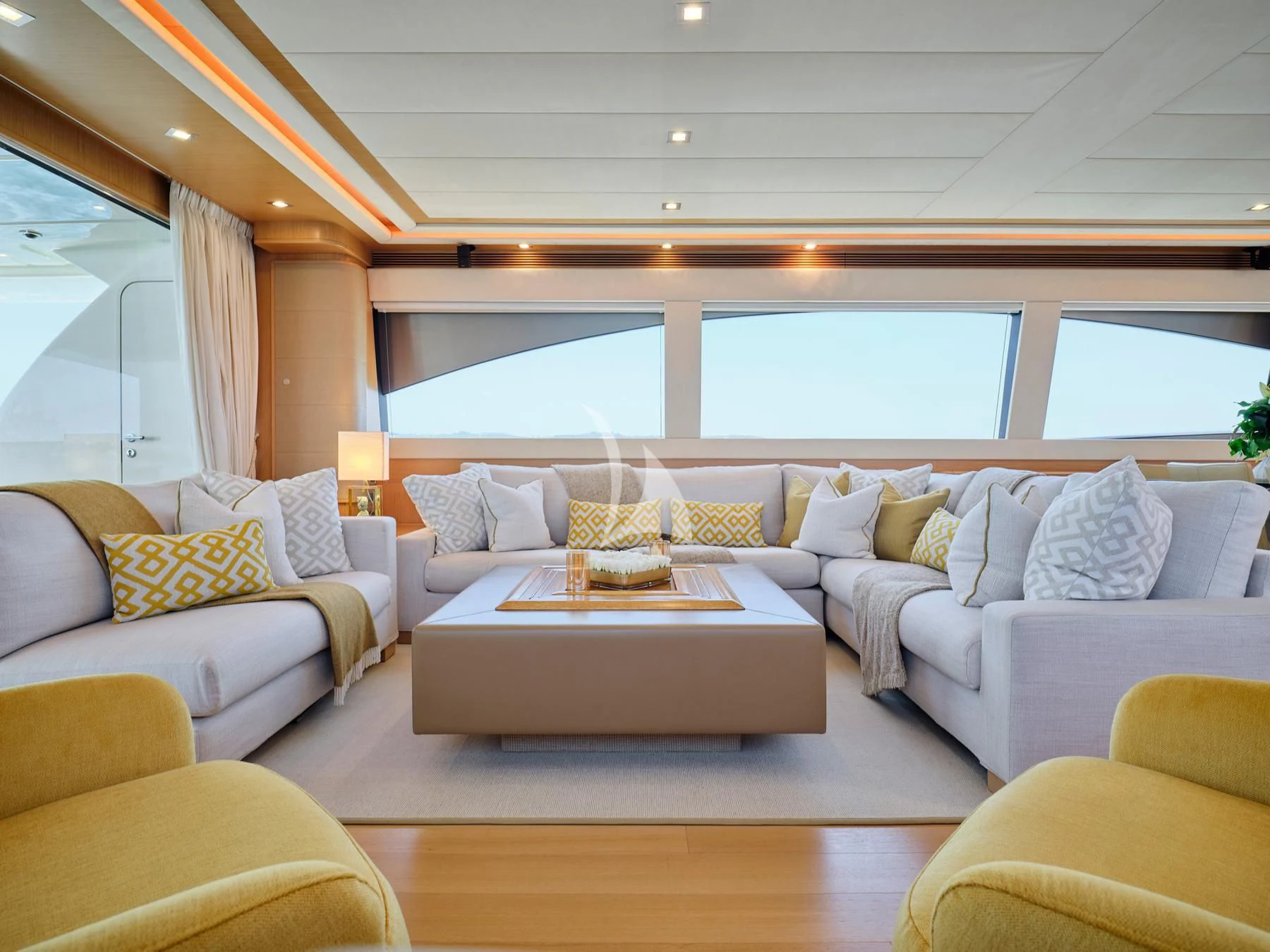 a living room with a couch and a table aboard JULIE M Yacht for Sale