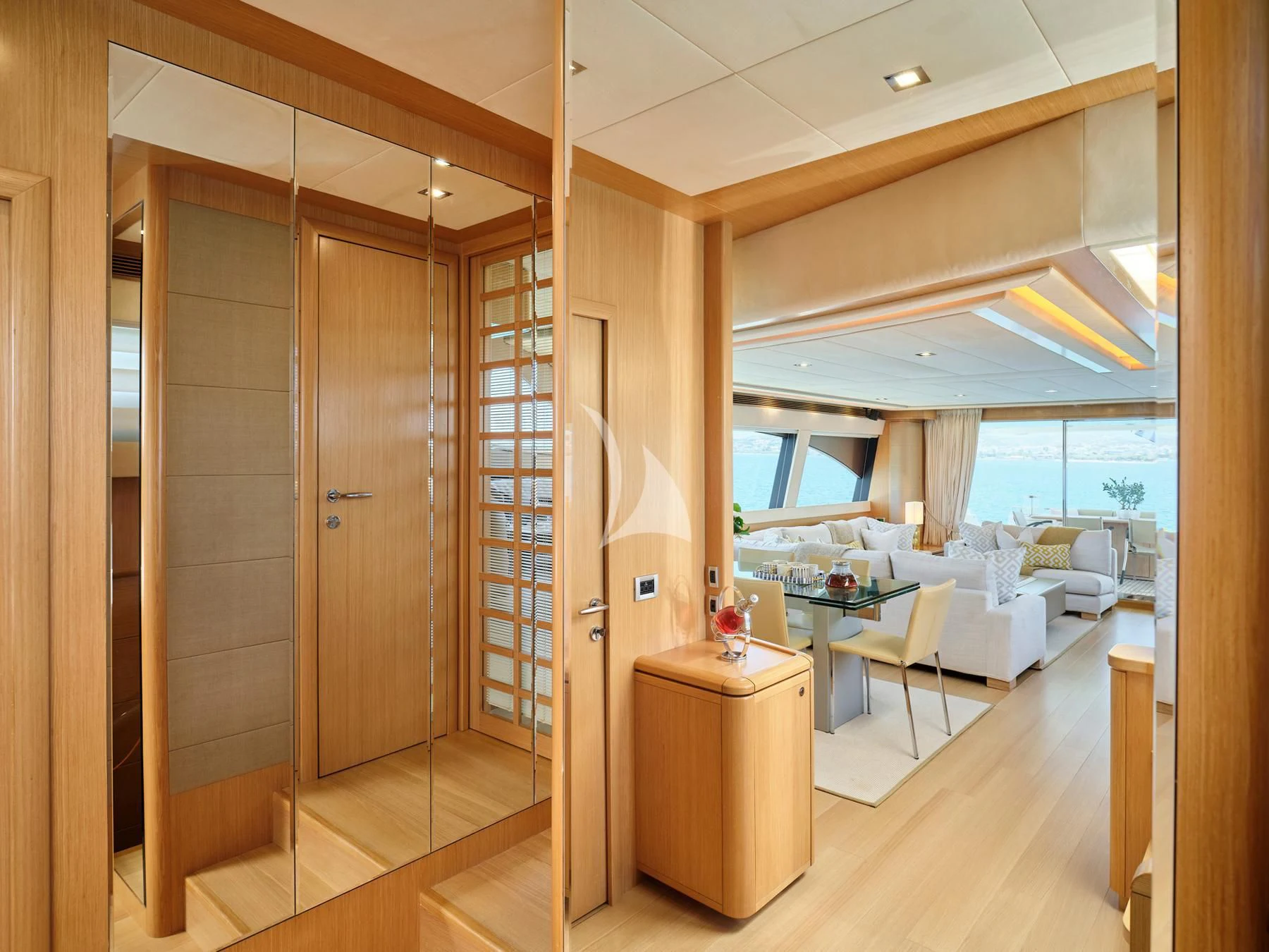 a room with a wood door and a glass wall aboard JULIE M Yacht for Sale