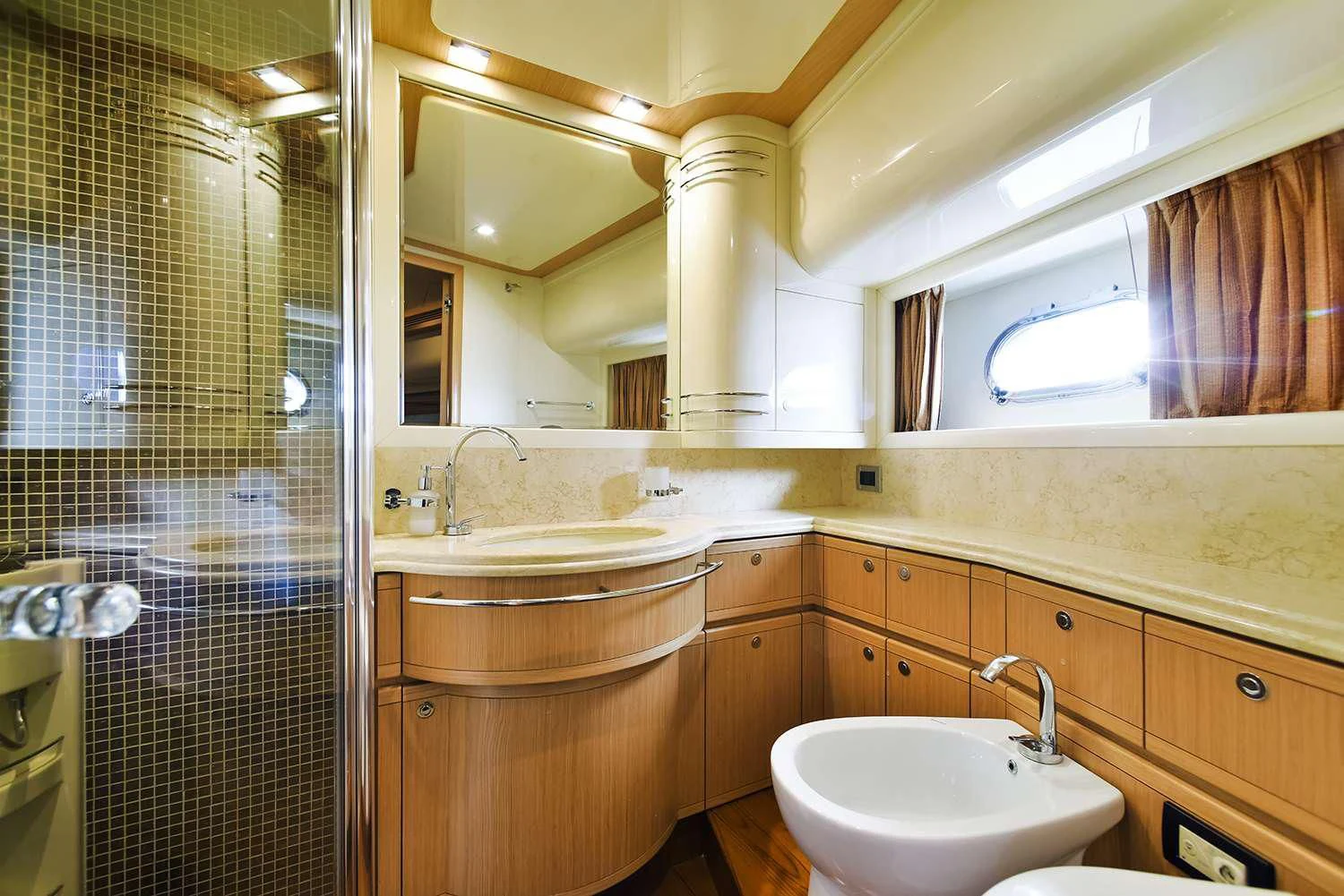 a bathroom with a sink and a shower aboard JULIE M Yacht for Sale