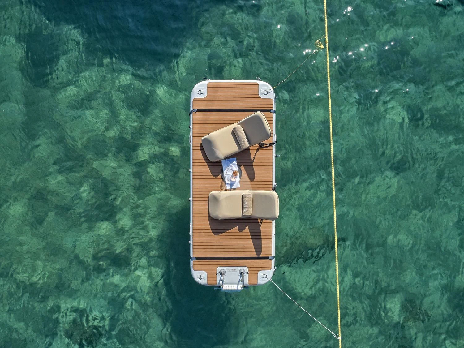 a drone flying over a green field aboard JULIE M Yacht for Sale