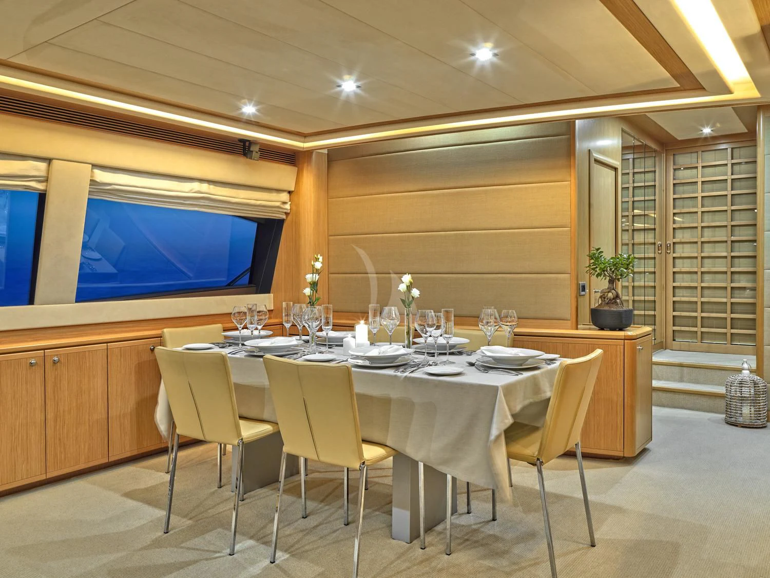 a large room with a table and chairs aboard JULIE M Yacht for Sale