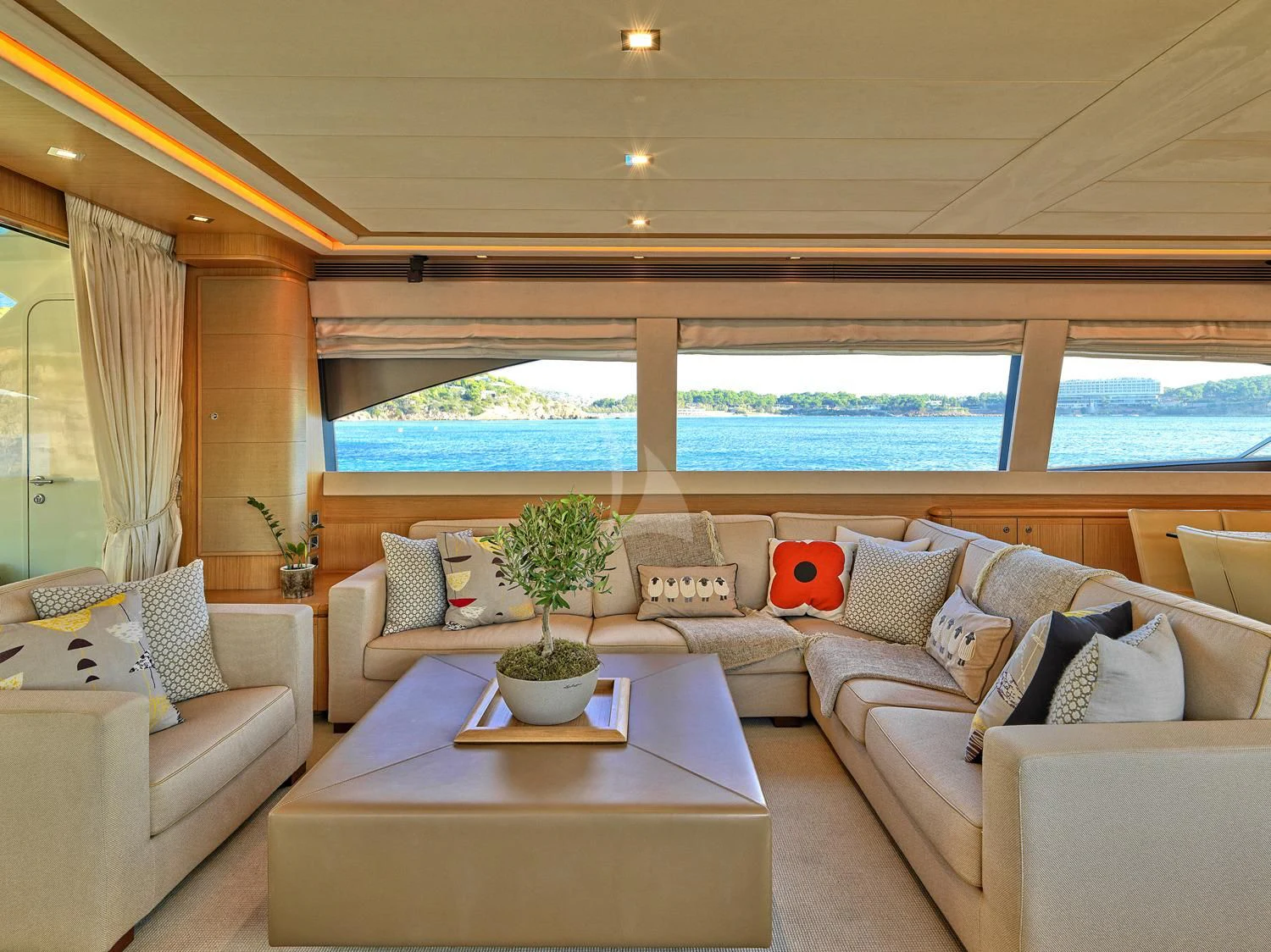 a living room with a large window aboard JULIE M Yacht for Sale