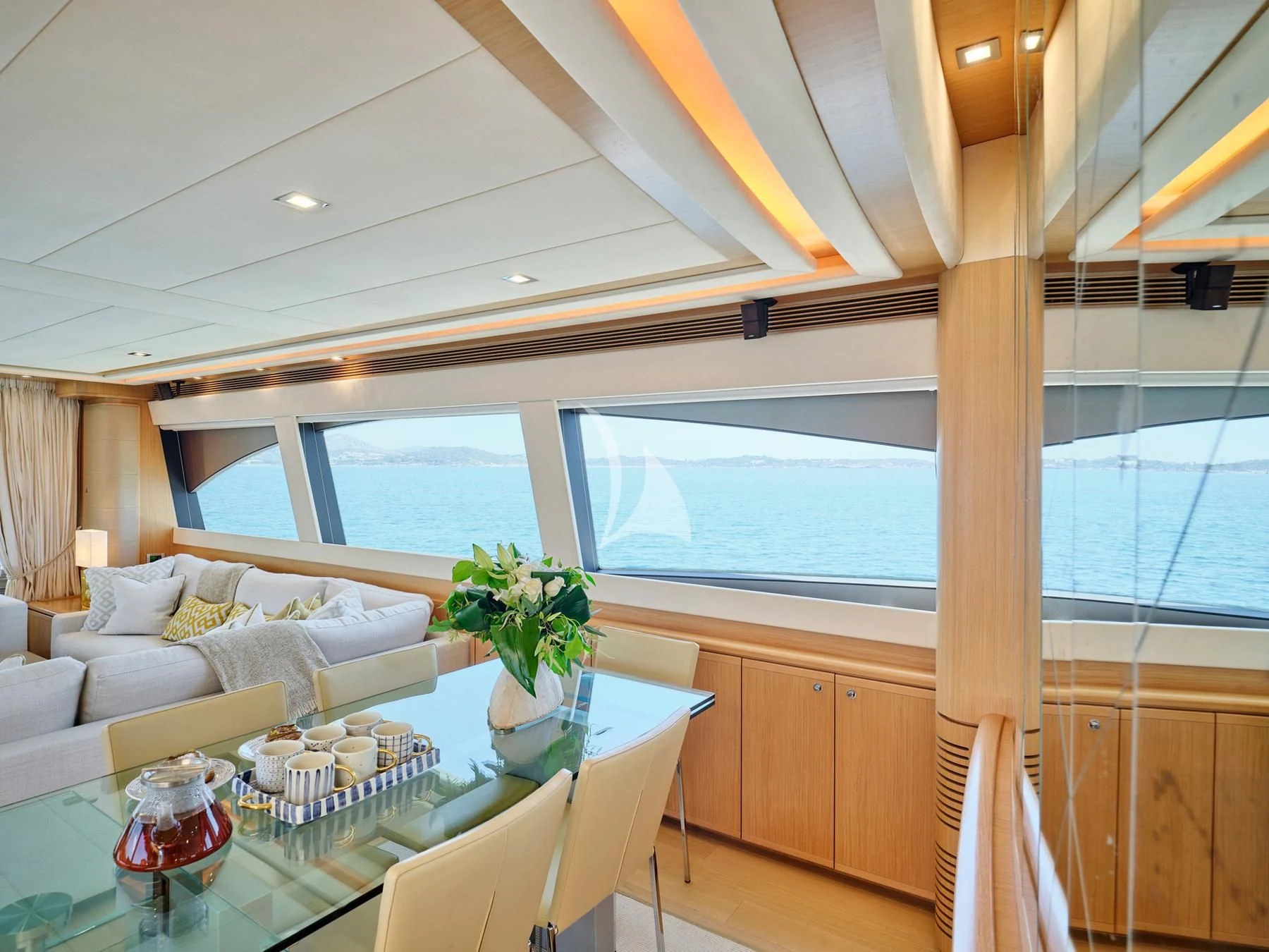 a room with a table and chairs aboard JULIE M Yacht for Sale