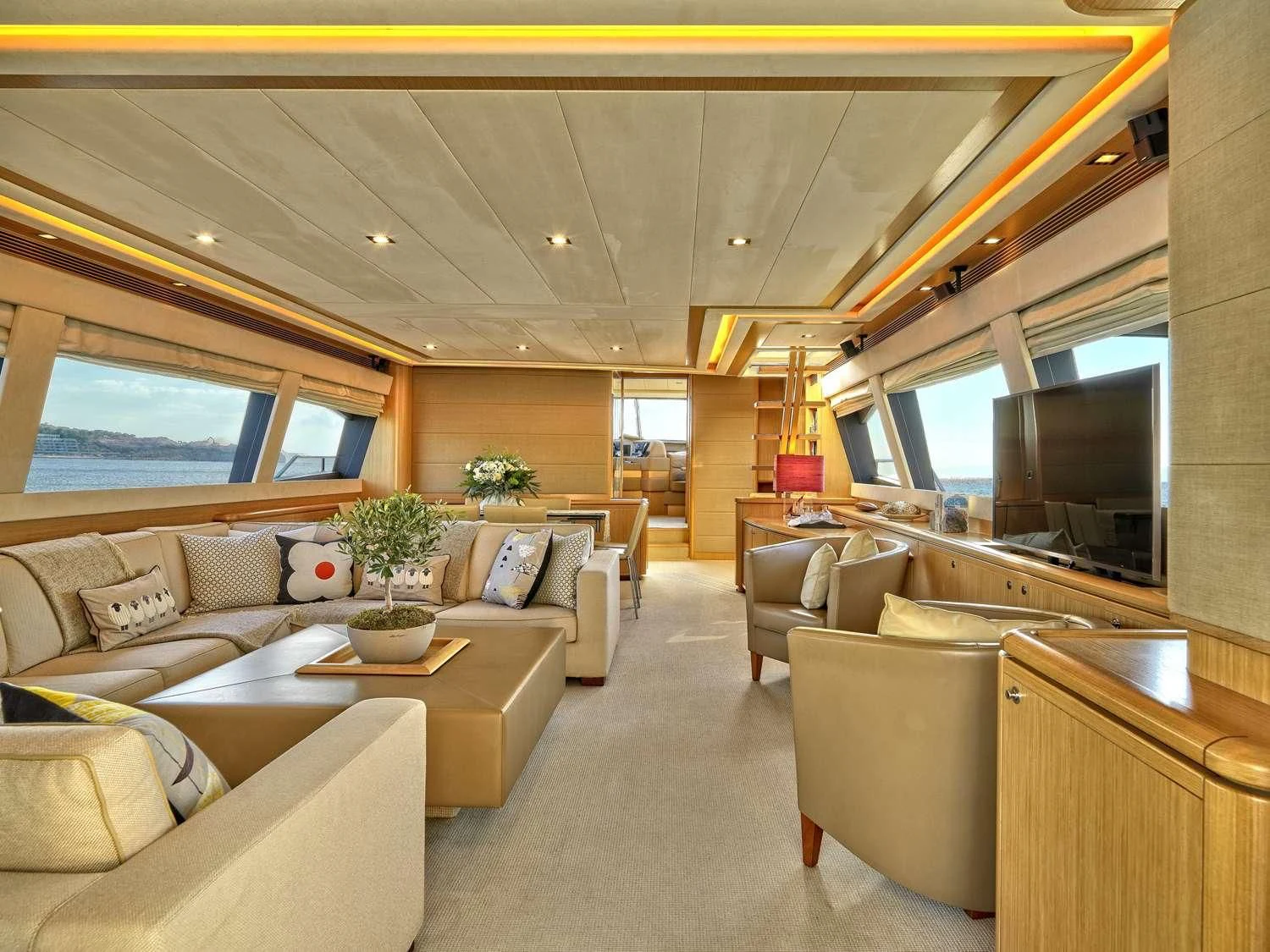 a living room with a large window aboard JULIE M Yacht for Sale