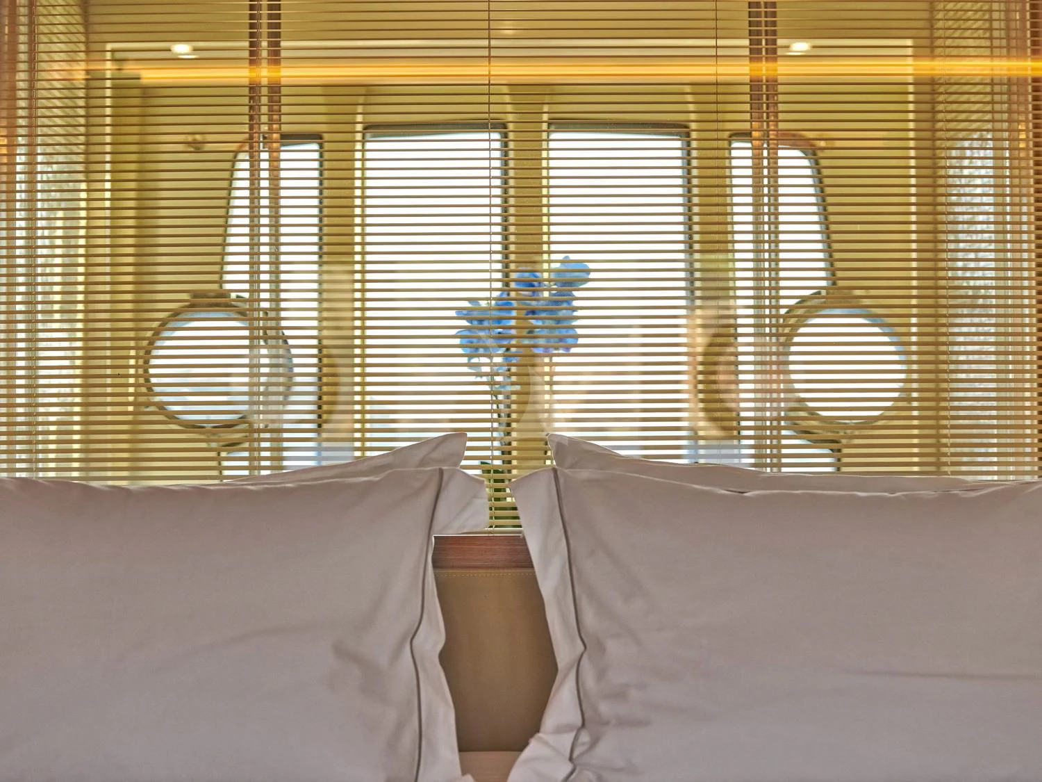 a room with a bed and a lamp aboard JULIE M Yacht for Sale