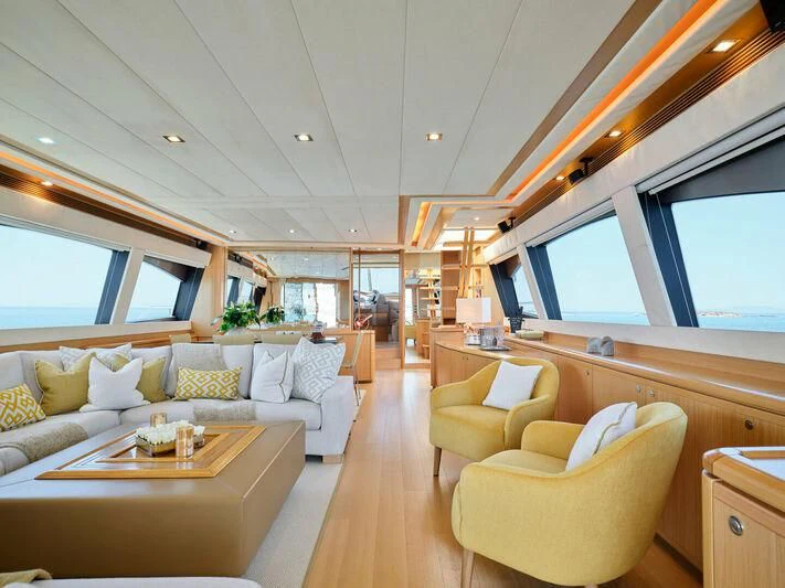 a living room with a couch and a table aboard JULIE M Yacht for Sale