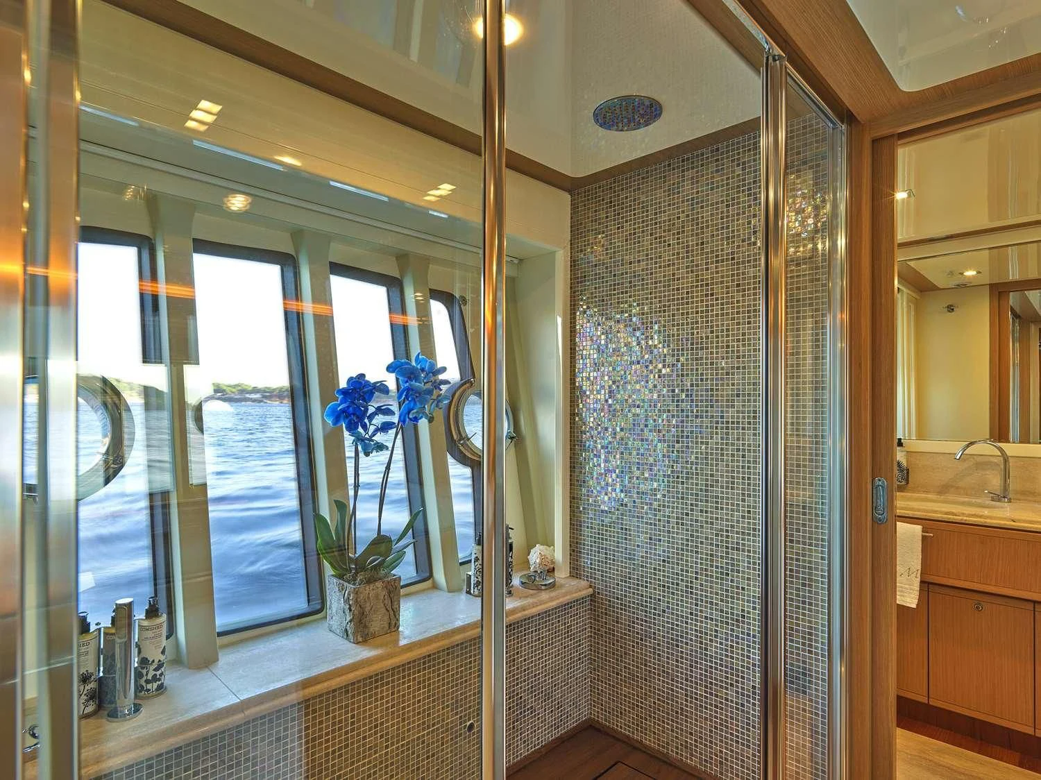 a bathroom with a glass shower aboard JULIE M Yacht for Sale