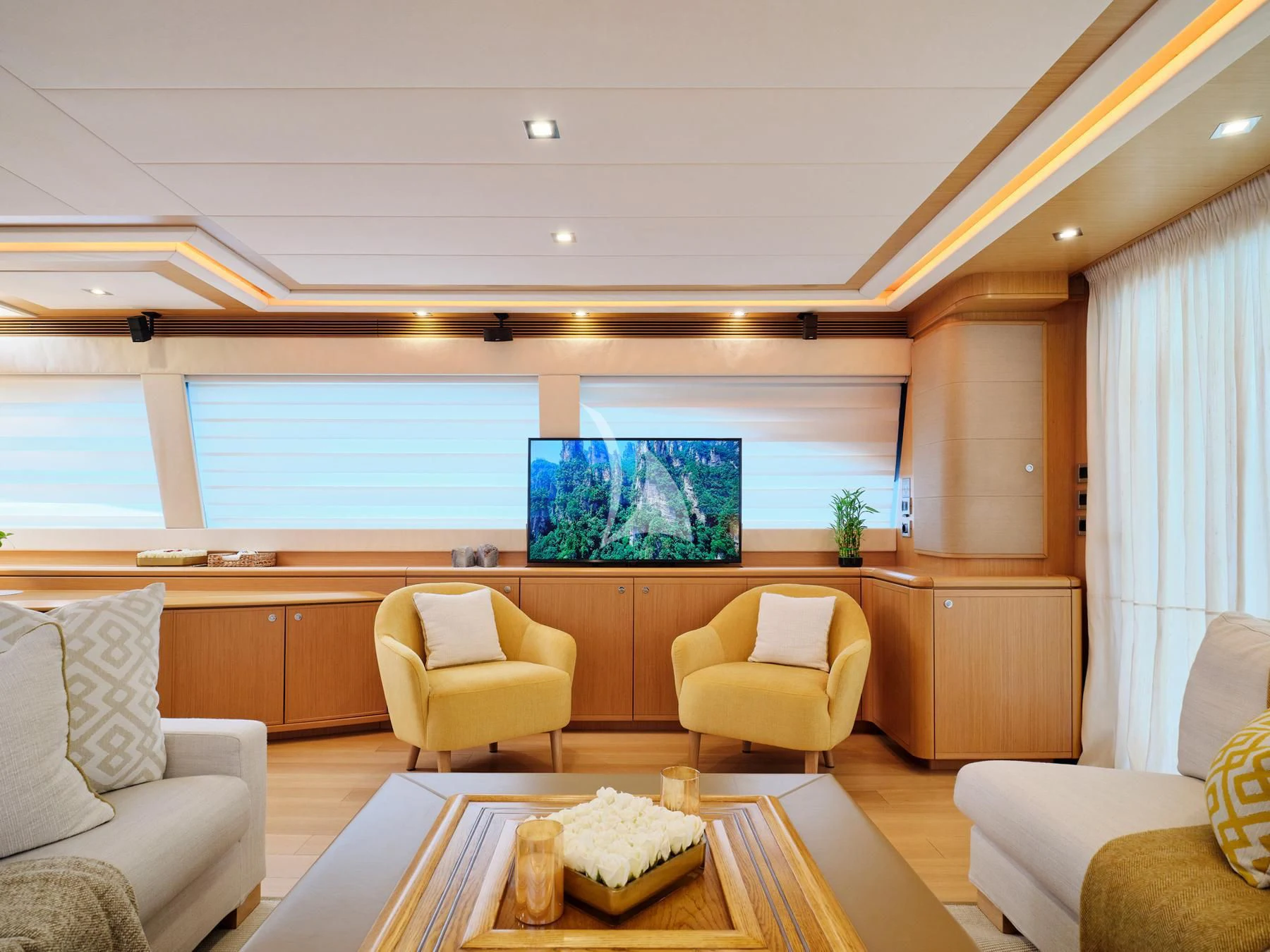 a room with a table and chairs aboard JULIE M Yacht for Sale