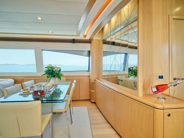 a kitchen with a table and chairs aboard JULIE M Yacht for Sale