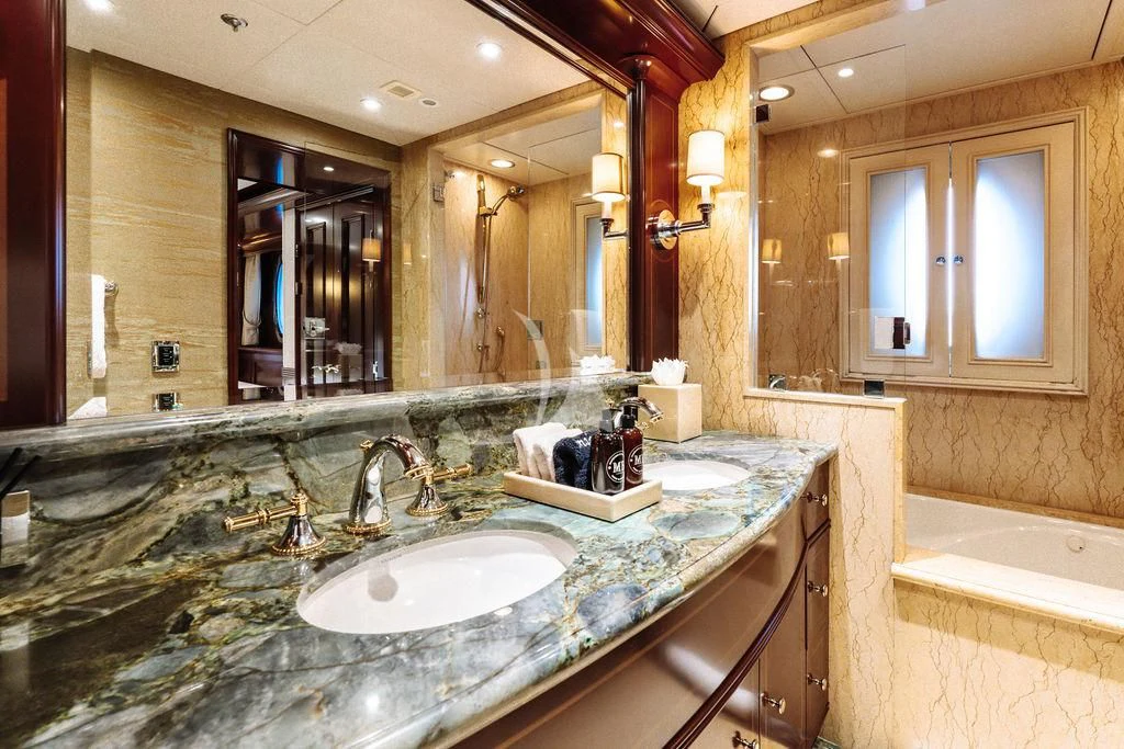 a bathroom with a large mirror aboard LADY BETH Yacht for Sale