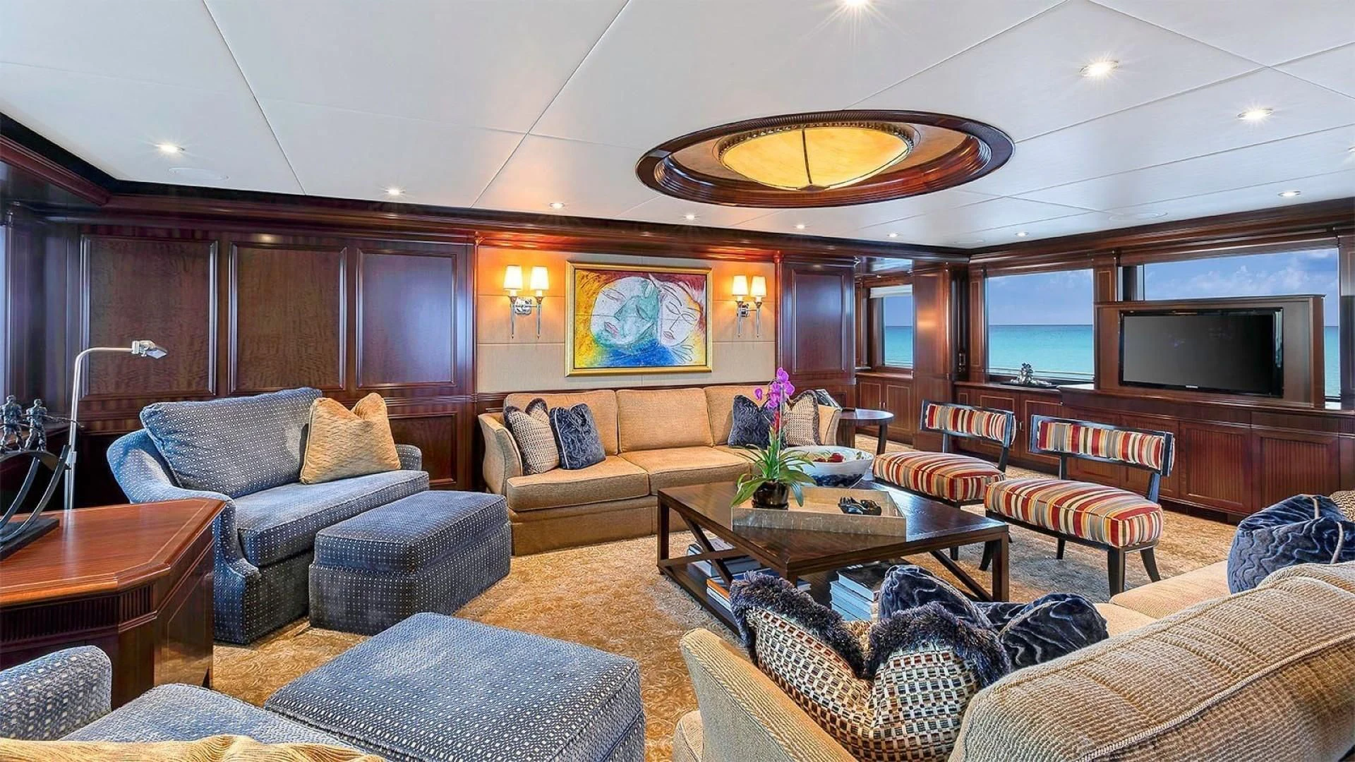 a living room with a large fireplace aboard LADY BETH Yacht for Sale