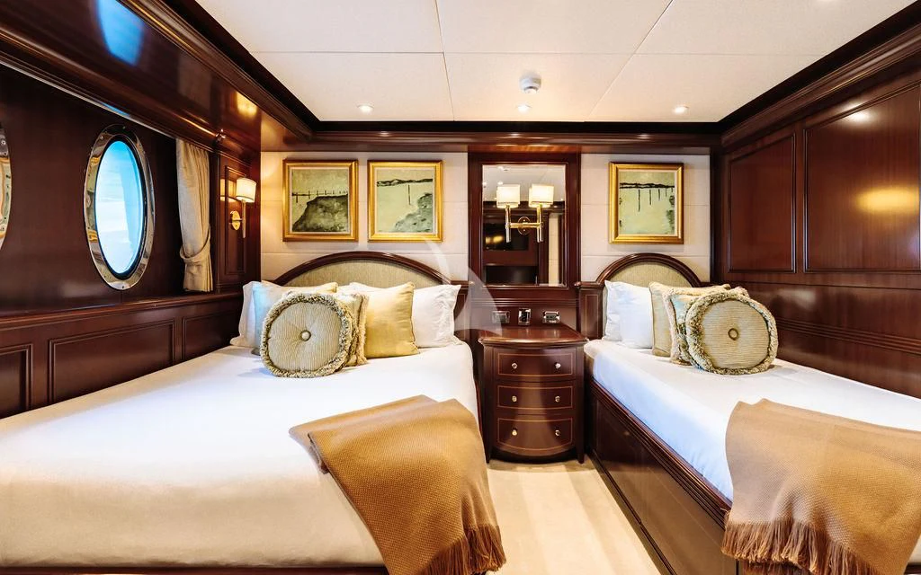 a room with a couple of beds aboard LADY BETH Yacht for Sale
